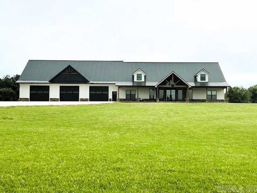 For Sale: Barndominium on 6 Unrestricted Acres – Mountain View, AR – Priced to Sell “As Is” at $699,500 This spacious 4,600 sq ft barndominium sits just outside the city limits of Mountain View, offering 4 bedrooms, 3 full baths, and farmhouse charm throughout. The open great room features a propane fireplace, while double barn doors conceal the laundry area. A bonus room above the 2,800 sq ft 3-bay garage adds extra space for guests or hobbies. Set on 6 unrestricted acres with a sweeping driveway (over half concrete), the property includes a second septic, water, and power hookup—perfect for adding a shop or second home. Only minutes from downtown Mountain View and its lively free weekend music scene, this property blends rural peace with small-town culture. Some finish work remains—priced to sell “as is” at $699,500.