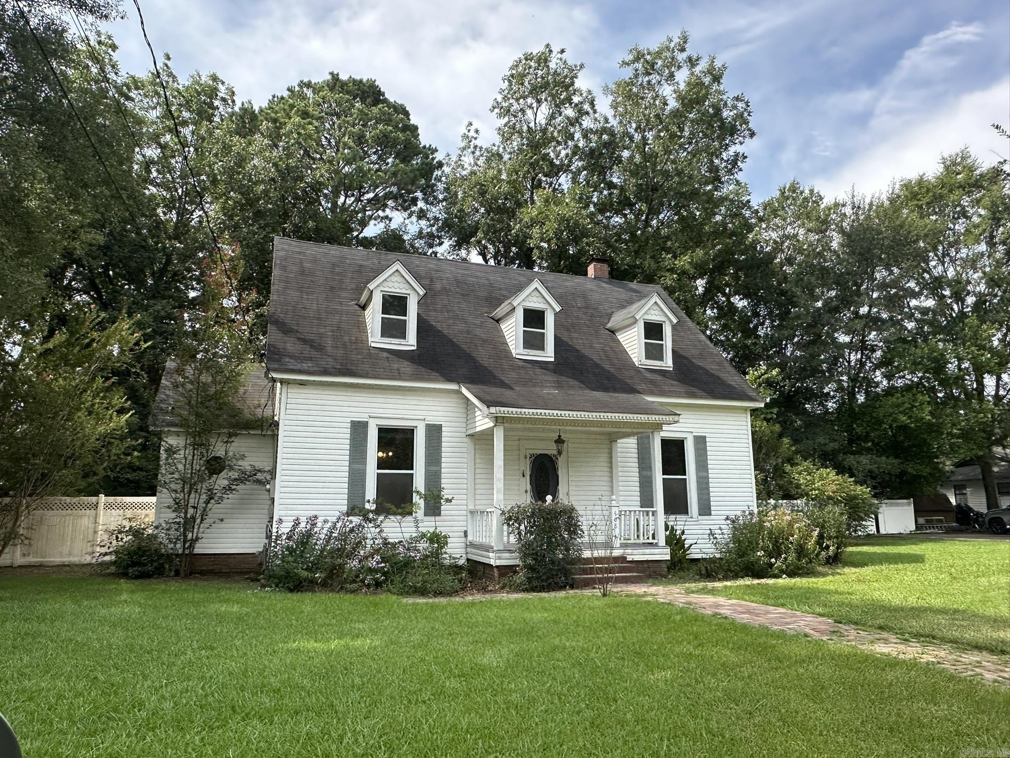 Welcome to this charming house in Hamburg, AR! This newly listed property features 3 bedrooms and 3 bathrooms, including a claw foot tub for a touch of vintage flair. The interior spans 2623 square feet with freshly painted walls and original hardwood floors refinished. You'll appreciate the beautiful trim details that add character to the space. This cozy home is conveniently located near the elementary school and the Hamburg square, offering easy access to local amenities. With its move-in ready condition and prime location in the heart of Hamburg, this property won't last long in today's market. Schedule your viewing today!