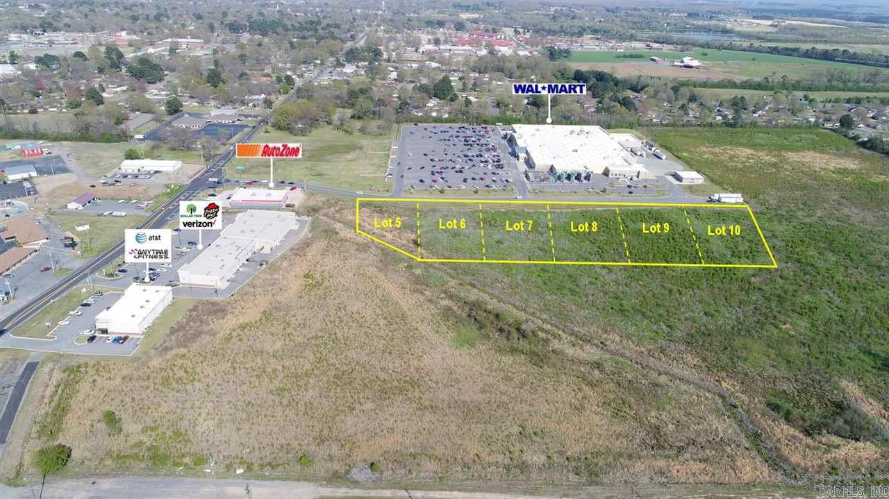 Prime Commercial Lot! Out-parcel to Walmart Supercenter located on W. Center Street. Approx. 150' frontage. Site is level & cleared w/city utilities available. Zoned C-2. Owner will re-divide according to Buyers needs. Excellent location for retail, office, or any general commercial use. Additional adjacent lots and acreage available. Some use restrictions may apply. Call for more information.