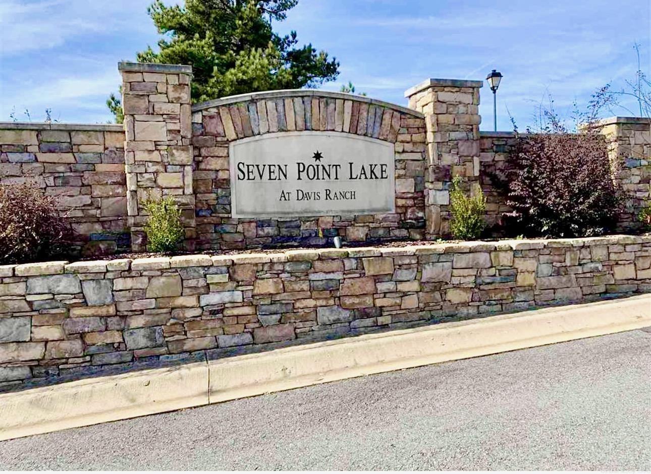 Beautiful views!!! This lot offers the ideal setting for your dream home, with $6,500 worth of clearing already completed to get you started!! Nestled within a secure, gated community, this beautiful lot offers a unique blend of nature and convenience. It's part of a peaceful enclave surrounding a sprawling 22 acre stocked private lake perfect for fishing and kayaking. Underground utilities and high speed internet are available. A paved waterfront jogging path graces the lakes edge providing an atmosphere that exudes peace and security. While enjoying a country feel, this location remains remarkably close to neighboring towns. It's conveniently located just minutes away from Vilonia, Cabot, Jacksonville and North Little Rock, making daily essentials and amenities easily accessible. Discover the best of both worlds with this remarkable land listing! Vilonia School District! ALSO.... the seller has the house plans for a gorgeous home that can convey with a full price offer!! (that's an appx $4,000 value). For more subdivision information, go to sevenpointlake.com