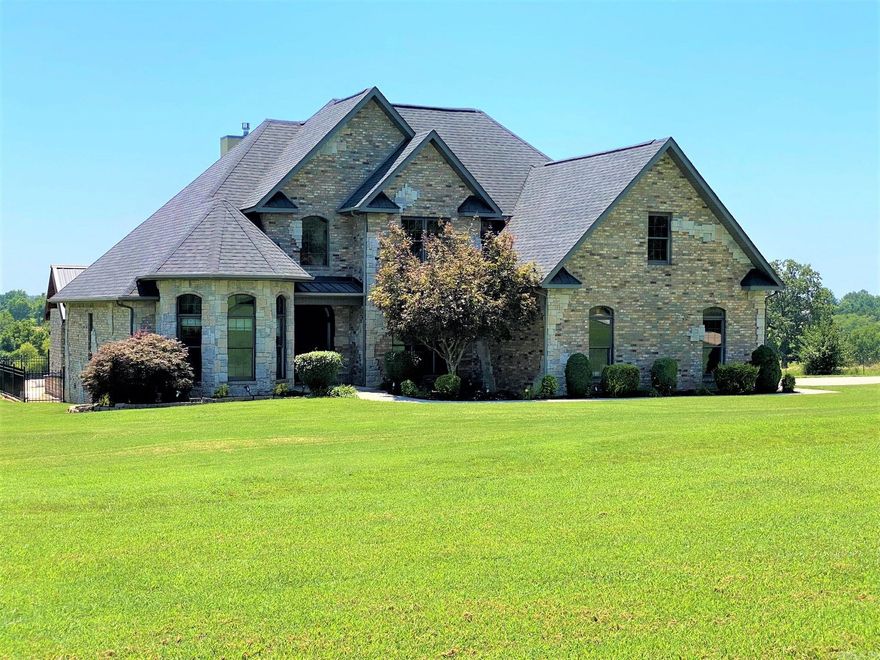 This Awesome all Brick & Stone Country Estate Features a level well groomed 2.59 ac/ml lot with a paved tree line entrance of the paved county road. Inside you will find a hard scraped wood floors, well-equipped kitchen with granite countertops, a split bedroom plan. The master bedroom features his & hers closets, a large jet tub, walk-in shower, his & hers sinks, plus a vanity. Upstairs is a lofted office space, with a view of the gorgeous Living room below, and a media room for your entertainment. Outside you will find a well-designed covered outdoor kitchen, fireplace & Big Screen TV. Take a dip in the large L-Shaped private swimming pool with a dining board. This Estate offers privacy and much enjoyment for your guests to enjoy. Check it out.