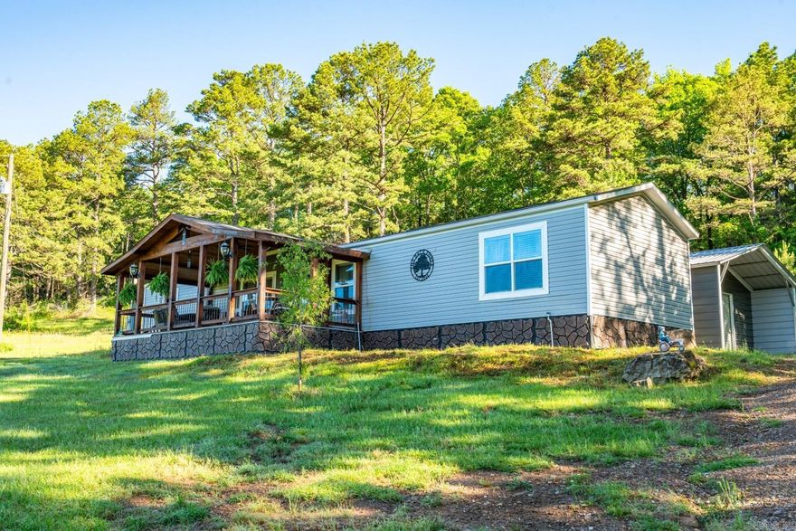 2020 3 bed/2 bath mobile home with custom built front and back porches and a 20x25 shop with overhang. This home had only been lived in for 5 months prior to sellers purchasing it and moving it to their property. Please note this land will not include the pond that is in front of the mobile home. Selling furnished.  Adjacent residence with 20 acres (MLS # 25018998) also for sale.