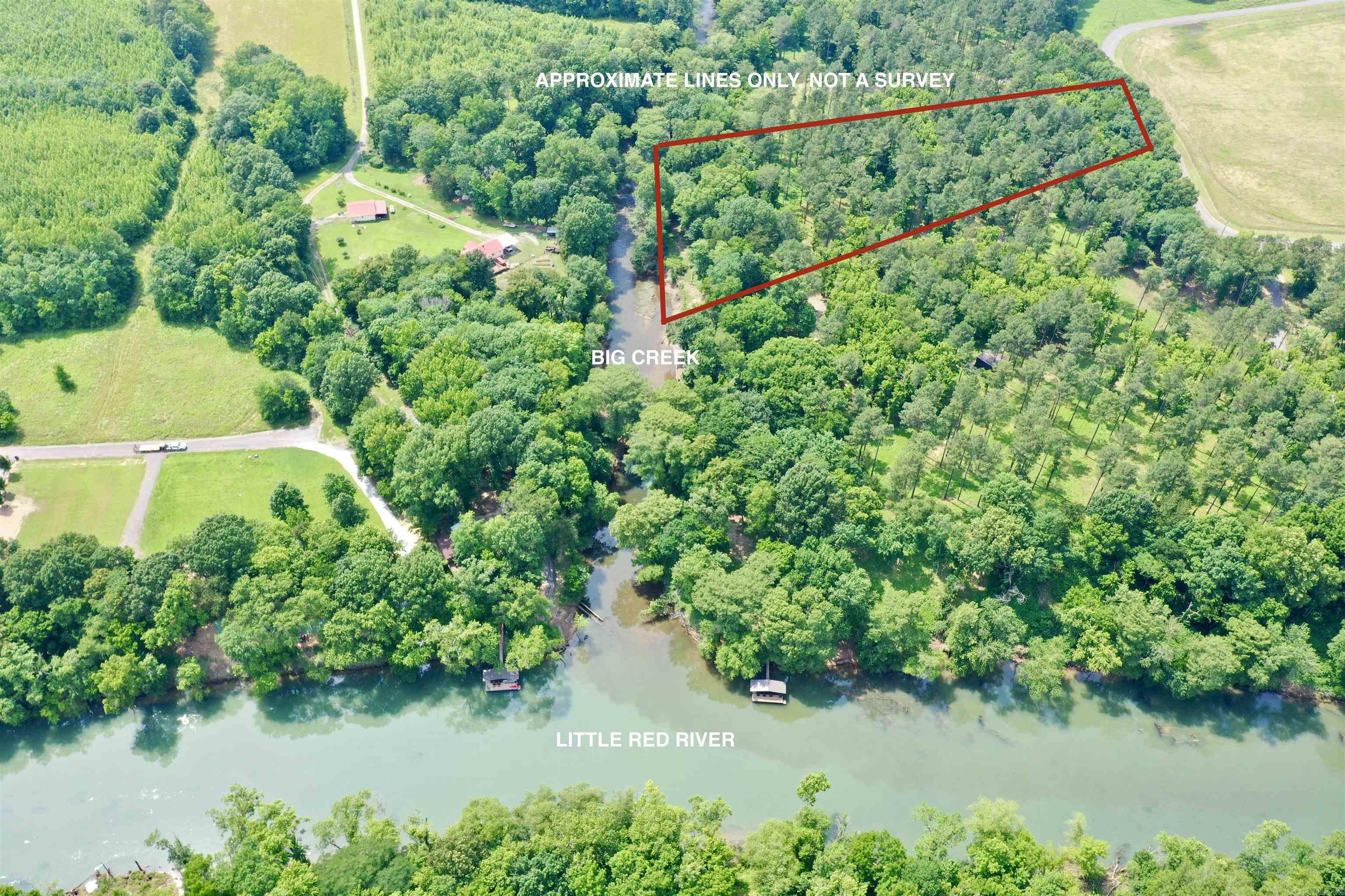 Beautiful 6.5-acre tract on the banks of Big Creek, flowing directly into the Little Red River, with approximately 600 feet of water frontage. Listing includes lots 14 & 15 of the newly developed River Creek Estates. This wooded and peaceful setting offers multiple building sites for your dream cabin or full-time residence. Lot 15 has a perc test on file, a cleared building spot, and an established driveway. Utilities are available at the road, making it easy to get started. Relax on your back porch and enjoy the soothing sounds of the creek, or launch a kayak and float downstream to the Little Red River—this is the perfect spot for peace, nature, and recreation.