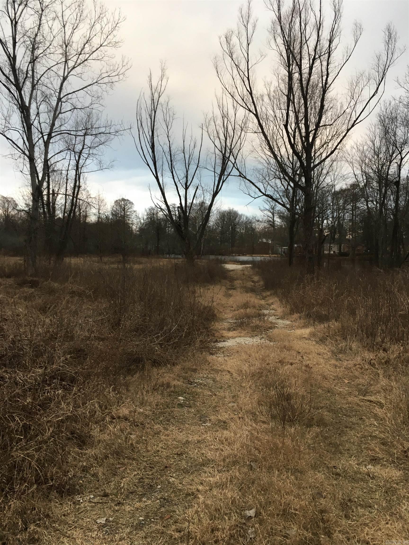 Looking for something nice, peaceful and quiet look no further!! This 10.03 acres of land includes a big beautiful stocked Pond. No utilities on the property. Itās close to the interstate, shopping centers, the McCain mall, restaurants and hospital.