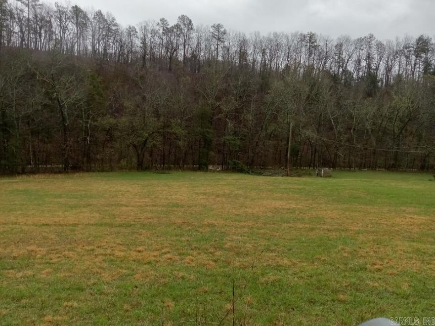 Beautiful, serene acreage! This 5+/- acre lot is ready for its new owner to build a home and enjoy the serenity of the area. A creek runs along the property. A well and electric utilities already on the property!