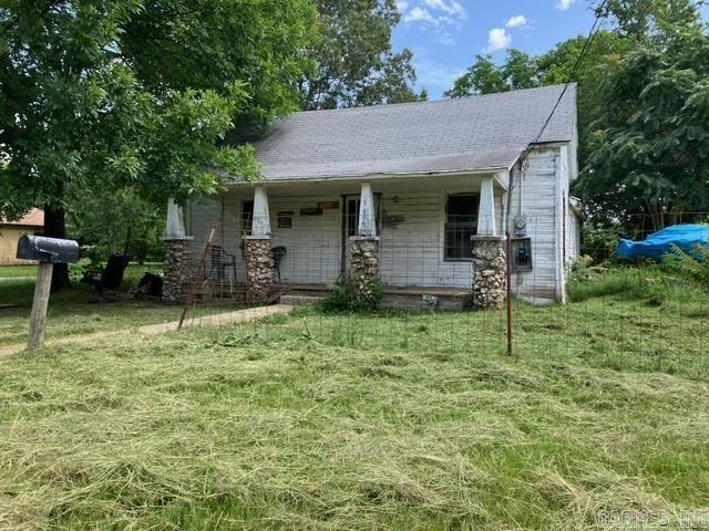 Corner lot in a very convenient location! Home is shaded by beautiful trees. Fixer upper. Home has some nice exterior character, potential to add a lovely covered front porch fronting Gilham Avenue when you redo the roof. Home needs a lot of work, but at a price that makes sense! Square footage is less than the courthouse shows, as the prior bathroom was removed and will need to be rebuilt.