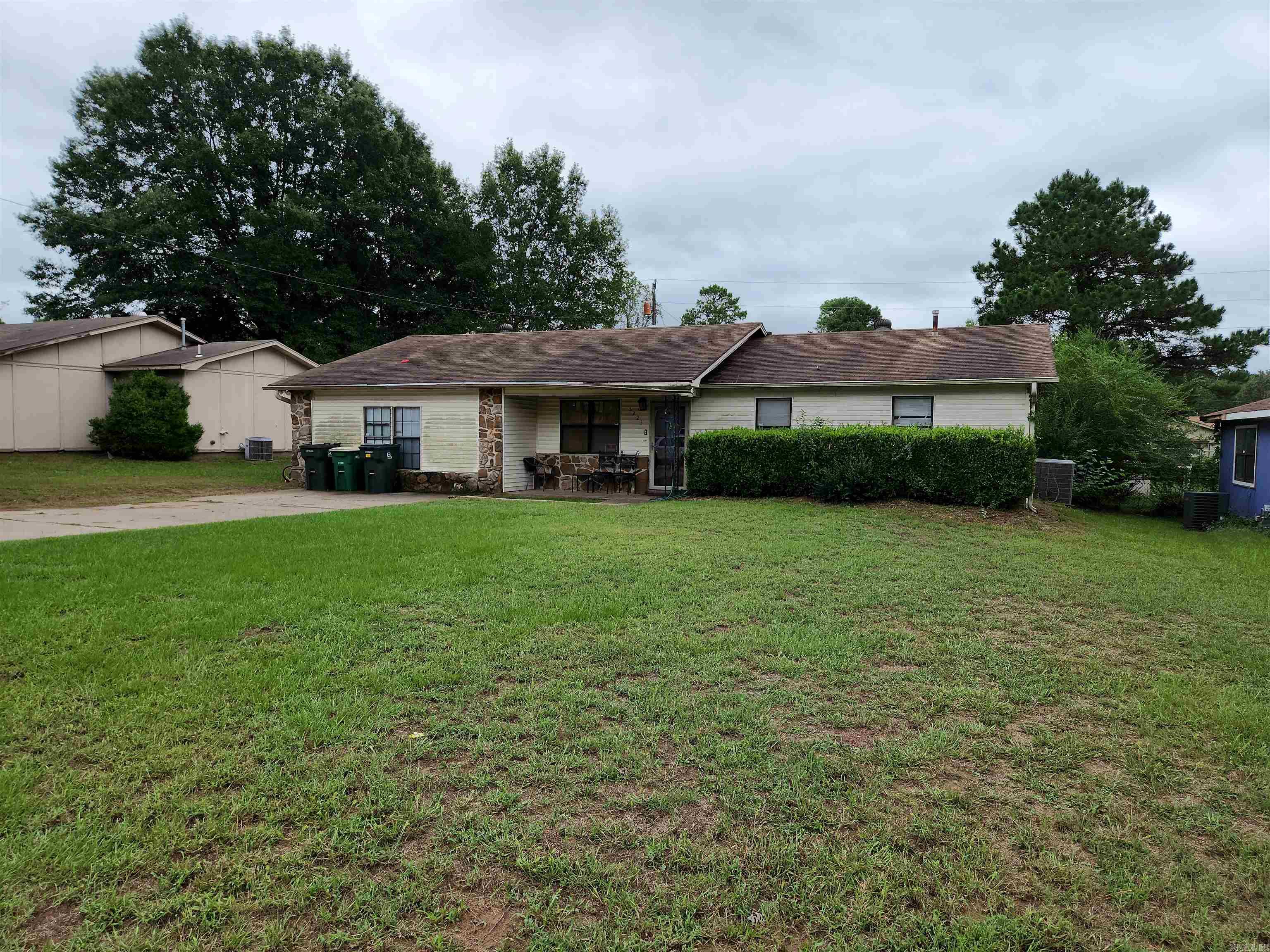 Do you have a large family? Are you looking for space? Well look no further because THIS IS THE HOME FOR YOU!! Its floor plan is SPLIT & has all the bells & whistles; 4 bd, 2 ba, living room, den, dining, fireplace, jacuzzi & sun porch that overlooks the level fenced backyard w/storage building & storm cellar! Kitchen comes fully equipped with appliances, granite counter tops & bar. Huge Den! Huge Master! Large closets! With a little TLC this home would shine bright like a diamond! PRICED WELL BELOW MARKET VALUE ((Property is located in LMI Census area which means 100% Financing offer with Select Lenders)) *****AGENTS SEE REMARKS*****