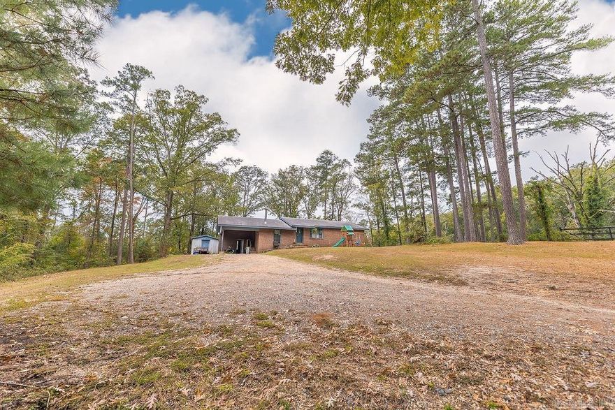 Located just outside of Camden, this charming 3-bedroom, 1-bath brick property sits on 1.77 acres and offers a peaceful country setting with plenty of privacy. The home is set back from the road and features a spacious yard perfect for enjoying outdoor living. Inside, you’ll find a cozy and functional layout ready for your personal touch. Additional features include a storage room and a small storage building, providing ample space for tools, equipment, or hobbies. This property combines quiet living with convenience to town — a great opportunity for anyone looking for a little extra space in a serene setting.