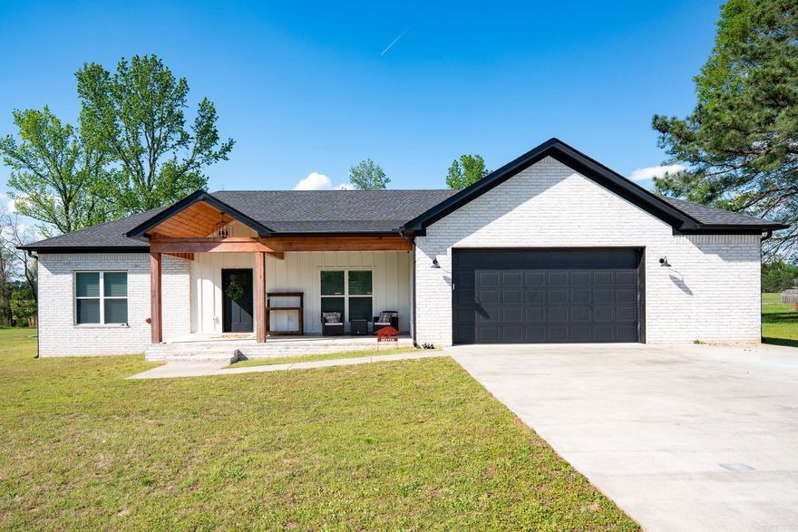 Welcome to this beautiful, custom-built home located in the heart of the Wooster!  This house is a custom Drew Hester build, that was meticulously crafted in every detail. This home offers 4 spacious bedrooms and 2 full baths. Stunning dark hardwood, laminate floors mix perfectly with the neutral paint colors and modern fixtures throughout. The kitchen features custom-built cabinets that compliment timeless white quartz countertops. An open floor plan highlights an airy and connected layout, emphasizing a seamless flow between the living and dining areas. The master suite bedroom is extra spacious, while the master bath features a his and her sink, custom cabinets, a striking tile wall detail and stylish tile flooring. The master closet has unlimited space with built-in drawers. Other components include recessed lighting throughout, a laundry room with built-ins and a versatile built-in locker area. Come and enjoy the serene country views this home has to offers.