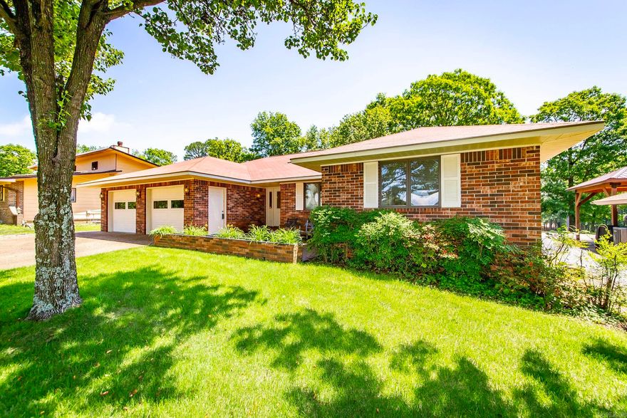 Nestled in the prestigious Indian Hills area near the 10th Green, this lovely home offers a blend of comfort, luxury, and timeless design. Perfect for those who appreciate the serenity of golf course living and also the active lifestyle. Interior Features: Dining Room with built-in hutch, Spacious Family Room, Kitchen with Corian countertops/backsplashes, Island (with wet bar & wine rack), numerous cabinets, drop-in stove, microwave, trash compactor, wall oven, and gas fireplace. Anderson Windows are installed throughout. Master Bedroom has an en suite with jetted tub and separate shower, Guest Bathroom en suite has a shower and soaking tub, and a third bedroom and ¾ Bath provide additional comforts. Exterior features: roomy Two-car Garage with 2 doors, Golf Cart Garage, Rear Patio (approx 15 x 30), and Lush Zoysia Lawn and sprinkler system. Fairfield Bay offers 3 swimming pools, a marina, pickleball, tennis, disc golf, bowling, restaurants, hiking/biking & ATV/UTV trails, spas, shopping and many festivals and productions.