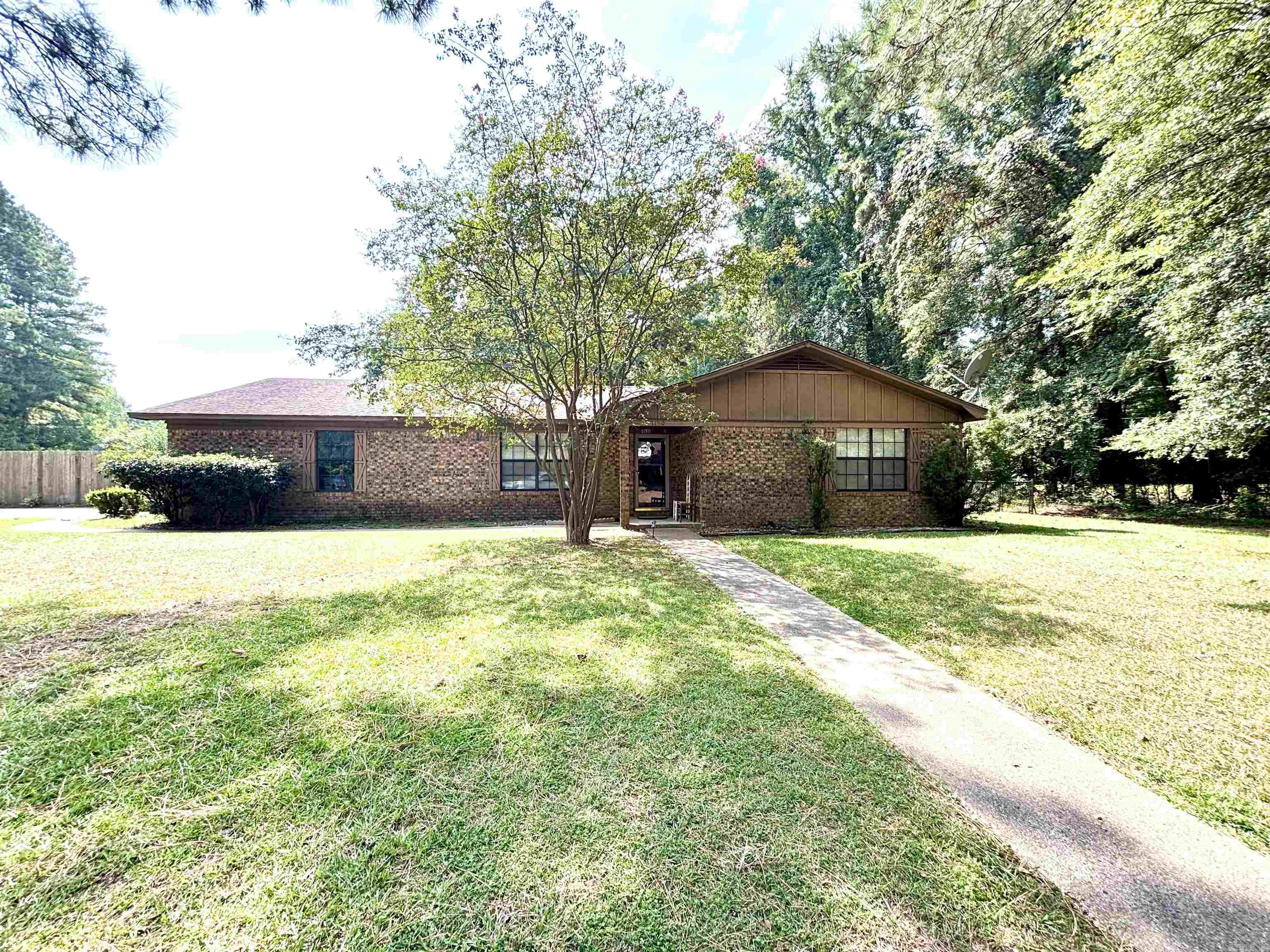 Charming 3BR/2BA brick home with great features! This attractive brick home offers an open floor plan with a large family room featuring a cozy gas log fireplace & newer flooring in most rooms. The spacious kitchen & dining area make everyday living & entertaining a breeze. Oversized bedrooms provide excellent closet space, with the primary suite boasting a walk-in closet & private bath with walk-in shower. Enjoy outdoor living in the privacy-fenced backyard with a covered patio plus a separate chain-link area - perfect for a garden or pets. Additional highlights include a double garage & a whole-house generator, giving peace of mind during power outages. A home designed for comfort & convenience - come see it today!