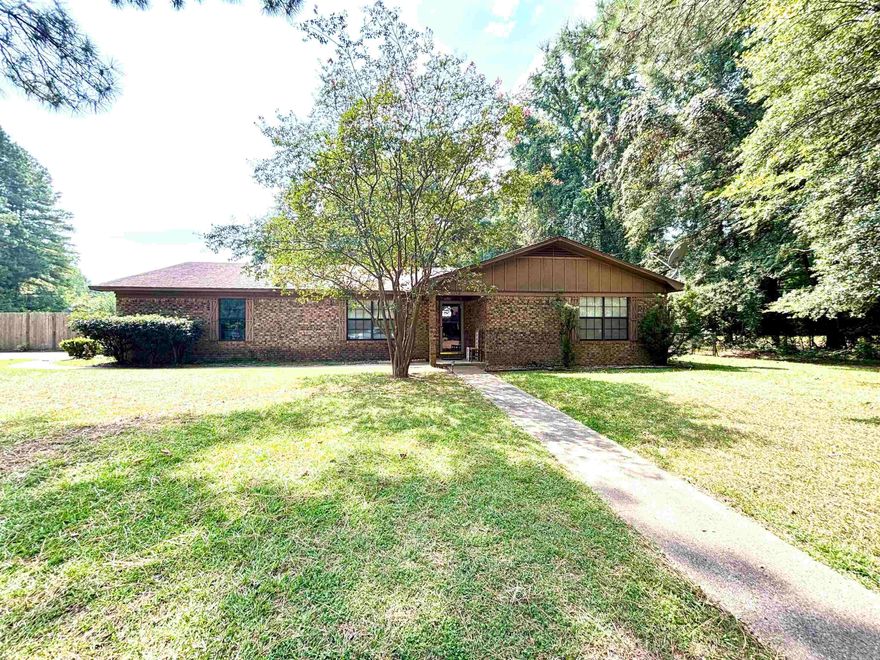 Charming 3BR/2BA brick home with great features! This attractive brick home offers an open floor plan with a large family room featuring a cozy gas log fireplace & newer flooring in most rooms. The spacious kitchen & dining area make everyday living & entertaining a breeze. Oversized bedrooms provide excellent closet space, with the primary suite boasting a walk-in closet & private bath with walk-in shower. Enjoy outdoor living in the privacy-fenced backyard with a covered patio plus a separate chain-link area - perfect for a garden or pets. Additional highlights include a double garage & a whole-house generator, giving peace of mind during power outages. A home designed for comfort & convenience - come see it today!