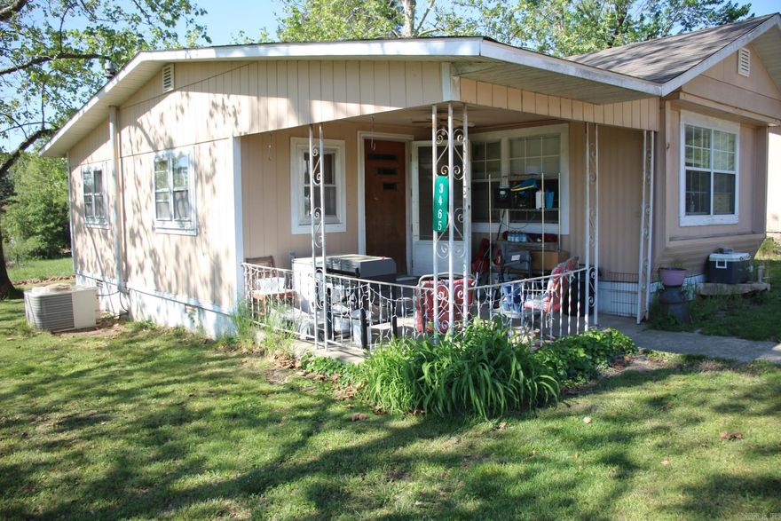 Just off Hwy 14 S and only miles from Buffalo National River and Crooked Creek sits this home and shop on 2.5 level acres with nice shade trees. This is a 2 bed 1 bath single wide mobile home with an add on and shop/garage behind.