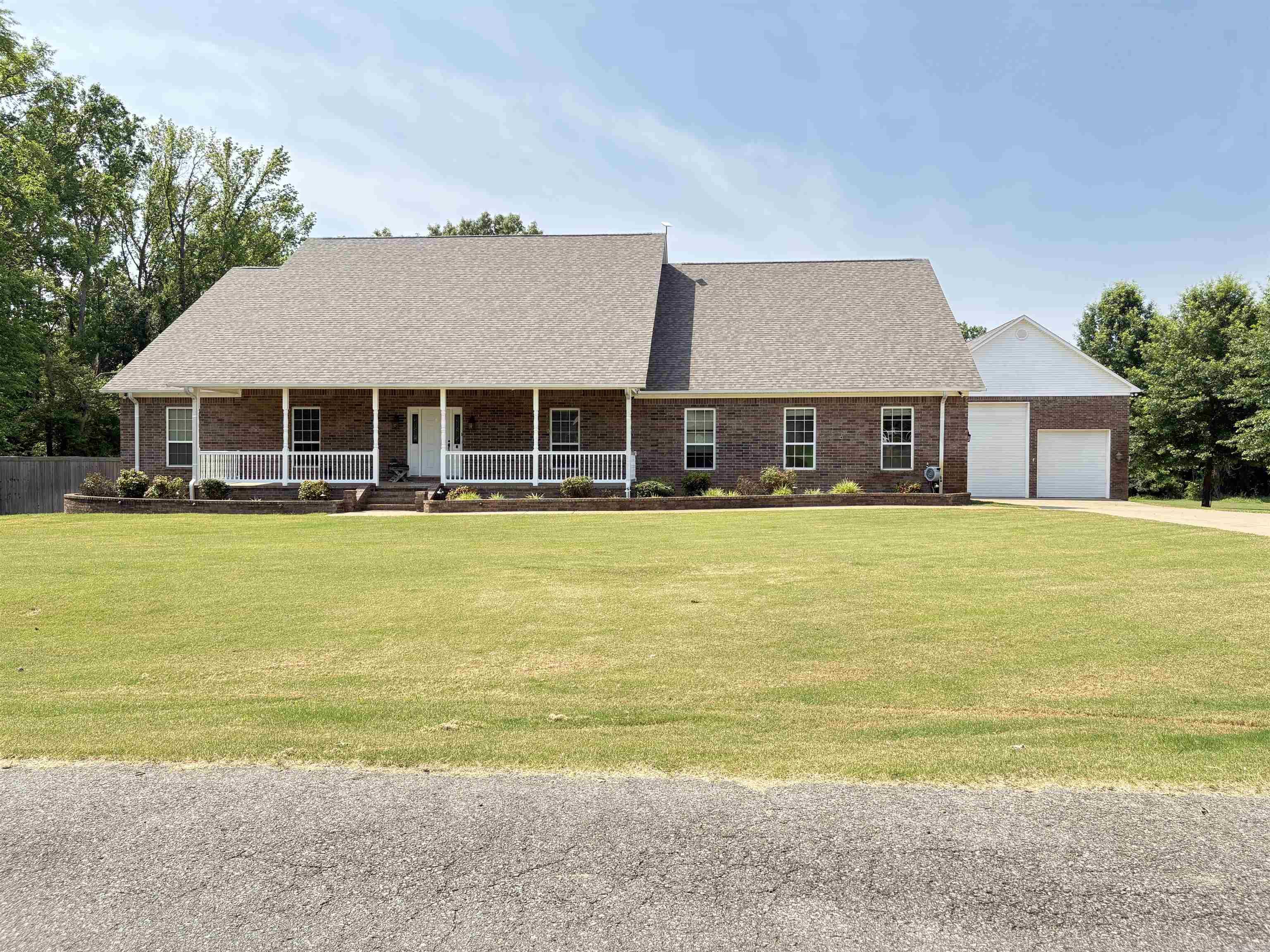 Beautiful home on 5.53 acres (approx 2 acres cleared) featuring an additional 30x50 shop with an RV overhead door, 220 hookup, and dumping station on separate septic. This home is a split master floor plan with 4 large bedrooms down, and a large 5th bed/bonus plus full bath upstairs. You will also find a sitting room, a sunroom, an office, a large laundry room, and a large heated and cooled storage room/closet. New Roof & hot water heater 2023, Salt water pool and pool house added 2019. New Salt Cell recently. Pool house features a fireplace, bathroom, storage closet and outdoor kitchen. This is an entertainers dream, come see!!
