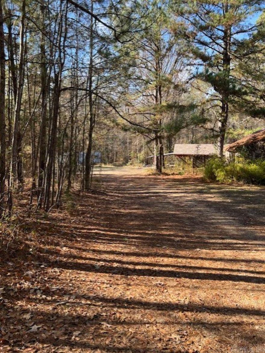 Whether searching for a quiet homesite or recreational site, this property is a must see.  Approximately 40 acres with natural springs and a small stream, rolling hills with a mix of hardwood and pine.  Camp house is a bonus with utilities onsite.  This property is located off I-30 and 10 minutes from Arkadelphia shopping, hospital and restaurants.