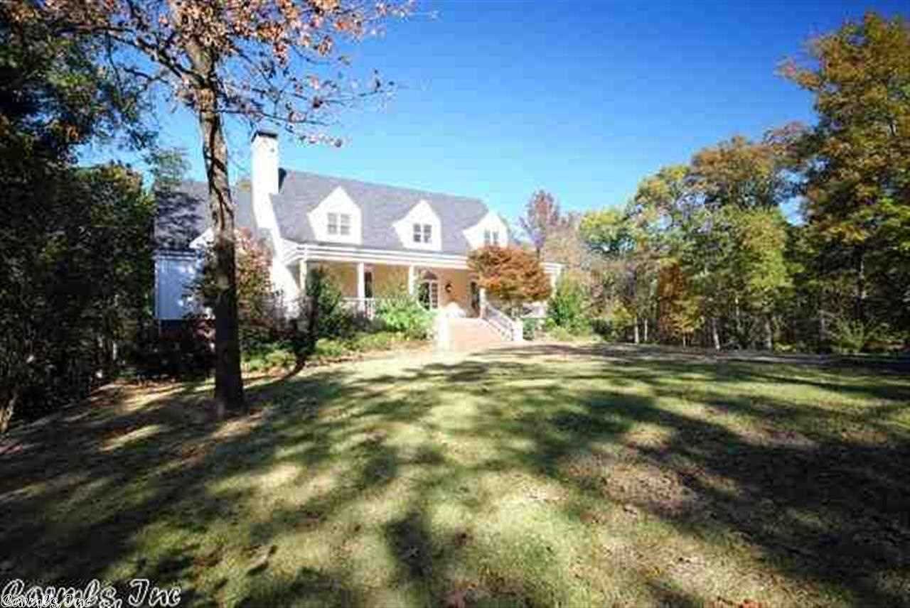 Magnificent County Estate, on six wonderful acres, two minutes from Chenal Parkway.This white clapboard farm house has the charm of a period farmhouse. Open floor plan flows easily for family living or large scale entertaining. The main floor master suite is well appointed and features an updated bath.Three additional bedrooms on located on the second level. Lower level features an abundance of climate controlled storage. Attached two car garage with a detached five car garage and full guest apartment.