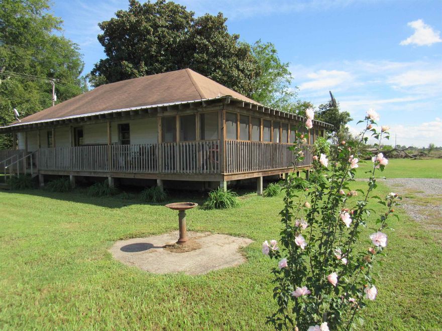 Farmers paradise! Over 6 Beautiful acres with well established Fruit trees, grape vines, black berry bushes, asparagus, a large garden and so much more. 2 homes, multiple outbuilding for shops/animals, a covered area for your RV AND an old Gin which is used as an incredibly large barn. One home has one bedroom, one bathroom, kitchen and living room completed with an additional 2 bedrooms, half bath and laundry room incomplete. The other one was originally an office and has been converted to a large 1 bed 1 bath home. Oversized kitchen with large laundry room/pantry. Photos really do not give this magnificent property justice.