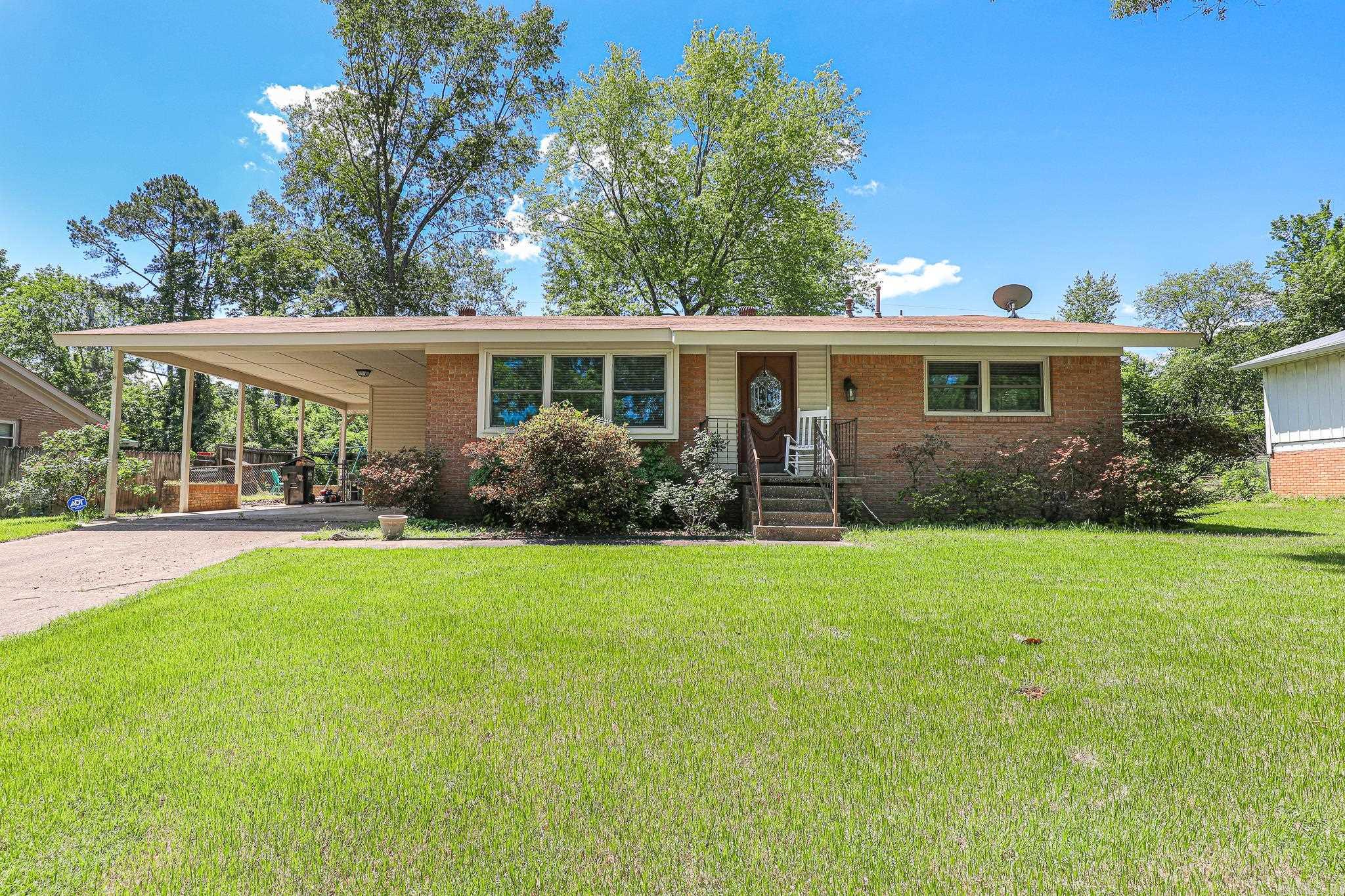 Great starter home super convenient to school! This 3 bedroom, 1 1/2 bath home offers you convenience and comfort! A huge Great room with cathedral ceiling and a wood burning fireplace gives you plenty of room to relax! The sunroom overlooks the large deck, perfect for entertaining! Stained kitchen cabinets with Granite countertops and a breakfast bar highlight the kitchen! Large formal living/Dining room could be another living area. Fenced back yard for pets and Kids but the yard goes beyond the fenced area. And a convenient Storage building! 2 car carport with carport storage. Super close to Howard Perrin Elementary! Very well kept home you will fall in love with!