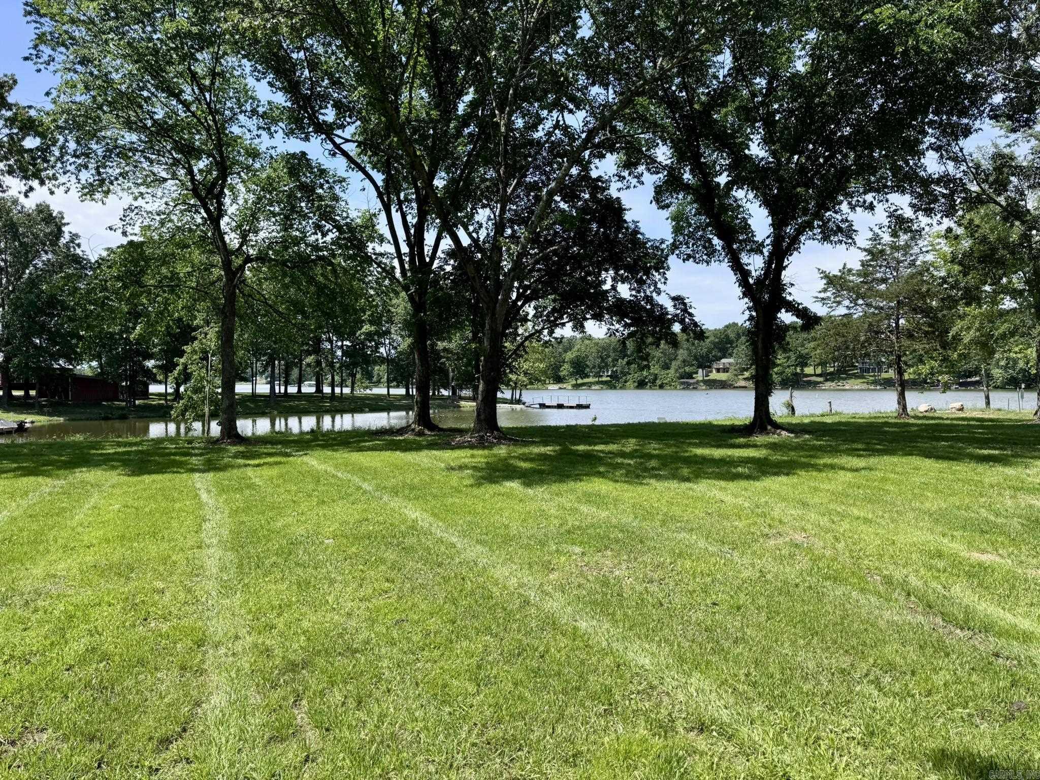 Donāt miss this rare opportunity to own a cleared lakefront lot on beautiful Crown Lake in Horseshoe Bend, Arkansas. This 0.63 +/- acre lot is located in the Pleasant Valley Subdivision and offers 195 feet of frontage on the scenic 640-acre Crown Lake. The property is level, shaded with mature trees, and features silt fencing already installed, making it easy to begin your building plans. Utilities are already in place, including water and electricityāsaving you time and expense during the construction process. Whether youāre dreaming of a full-time lake home or a peaceful vacation retreat, this lot offers the perfect setting for your vision. Priced at $79,900, itās a fantastic investment in lakefront living.