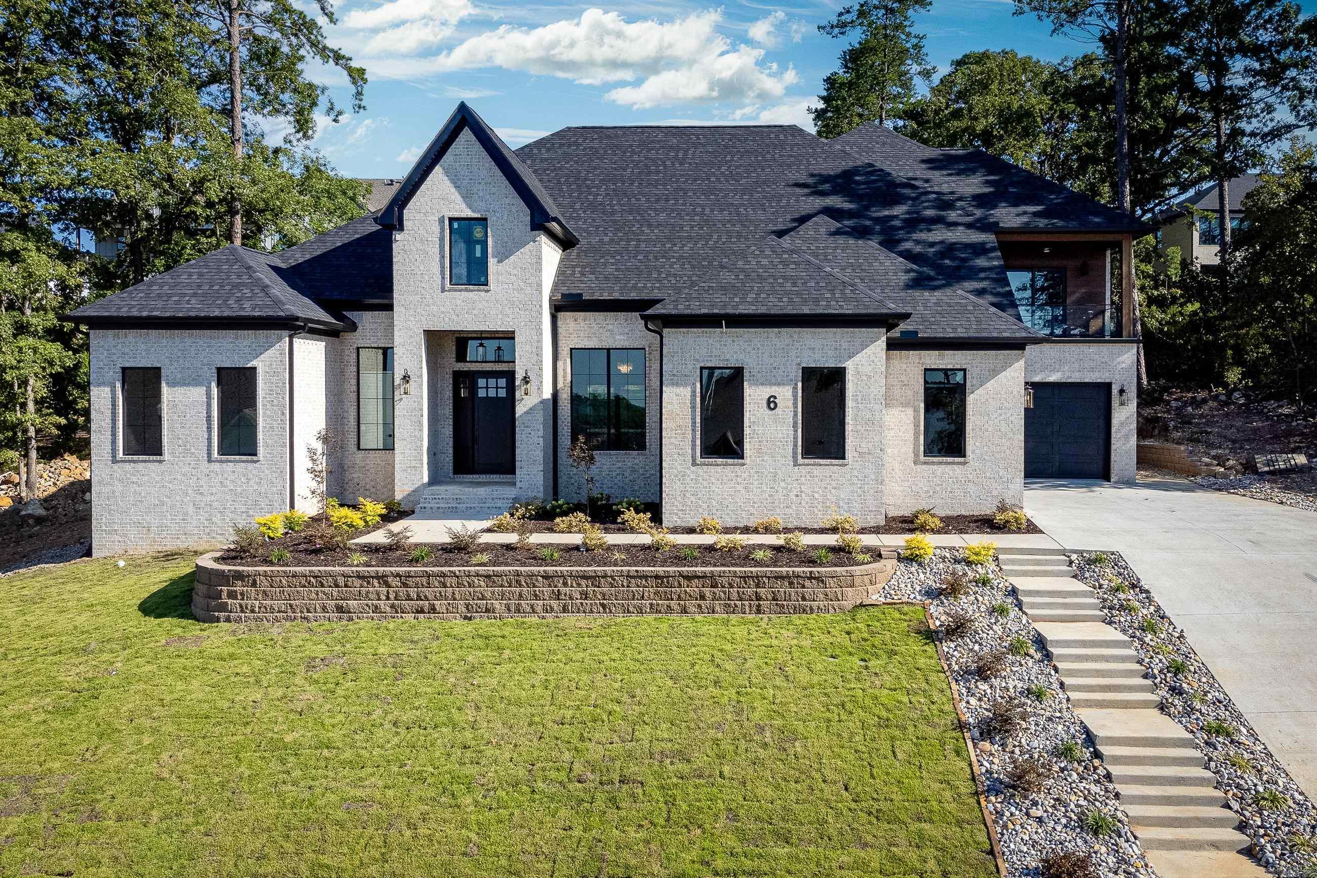 Enjoy all the amenities of this new home including the primary bedroom and ensuite bath featuring not one, but two walk in closets! A gorgeous great room with a tile fireplace as the focal point and double glass doors providing abundant light and a view of the outdoor. Open Kitchen has a waterfall island plus a breakfast room. Incredible light fixtures throughout. Two additional bedrooms with ensuite baths on the main level. Upstairs offers a second living area with a wet bar and refrigerator. Falstone is known for its views and they can be enjoyed from the covered patio in the backyard and an additional patio off the upstairs with beautiful views from the front of the home. Schedule your tour of this remarkable home today! Lease purchase option available.