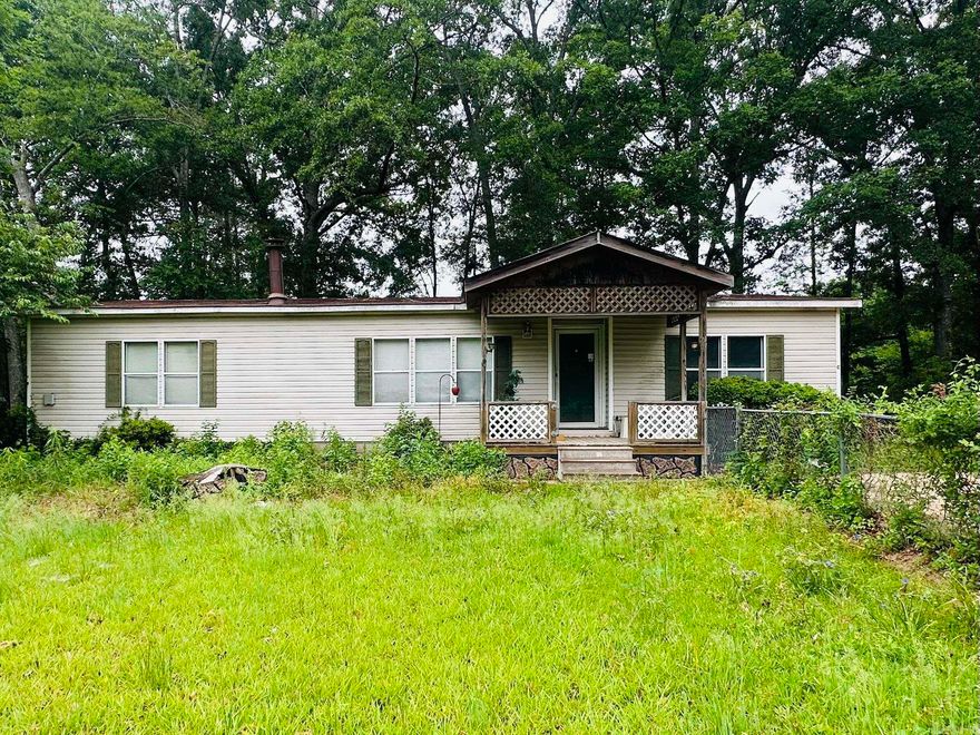 1993 Mobile Home on 2.18 acres - 1,456 sq ft.  3 bedrooms, 2 bathrooms, Large Living Room with new Gas Heater.  (AC central unit works, but gas central unit does not.) Eat in Kitchen, laundry room, nice size deck in back, with 2 storage buildings covered carport.  There is a second home on the property.  It has not been lived in 15 plus years.  1,118 sq ft - 3bed/2 baths. Property would need some TLC o make it livable.   This could make a good rental investment property.