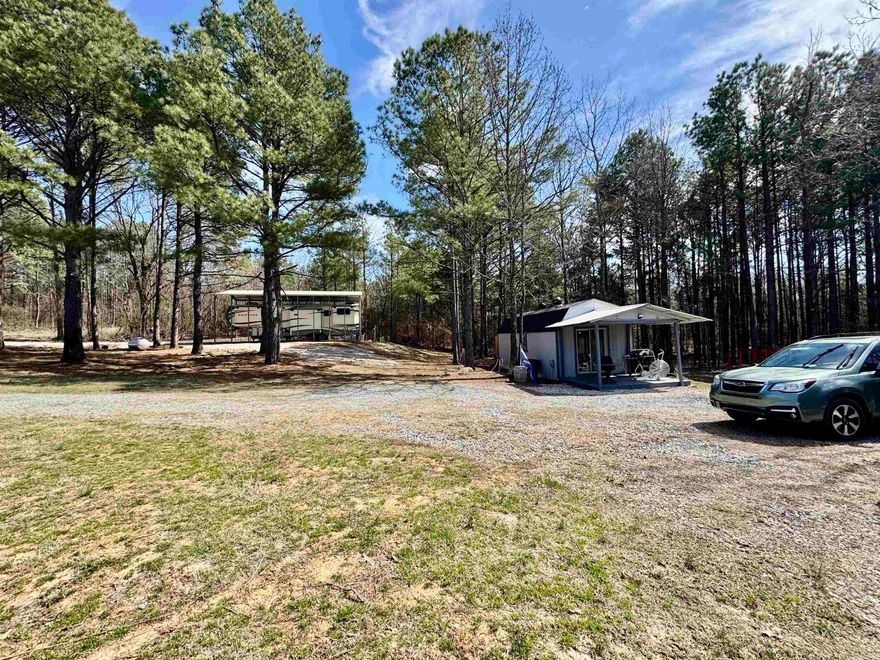 Tiny home on level 1.83 acres in Bismarck School Dist. Kimsey water, septic, propane tank (owned), fiber internet, and electric are all on site! RV shed has all utilities and hookups. This would be an amazing place to stay while you build your dream home or mobile home. The Tiny home has roomy bathroom, open floor plan, and two loft sleeping areas. The mini split HVAC is ample to keep the home comfortable. All appliances and/or furnishing are negotiable.