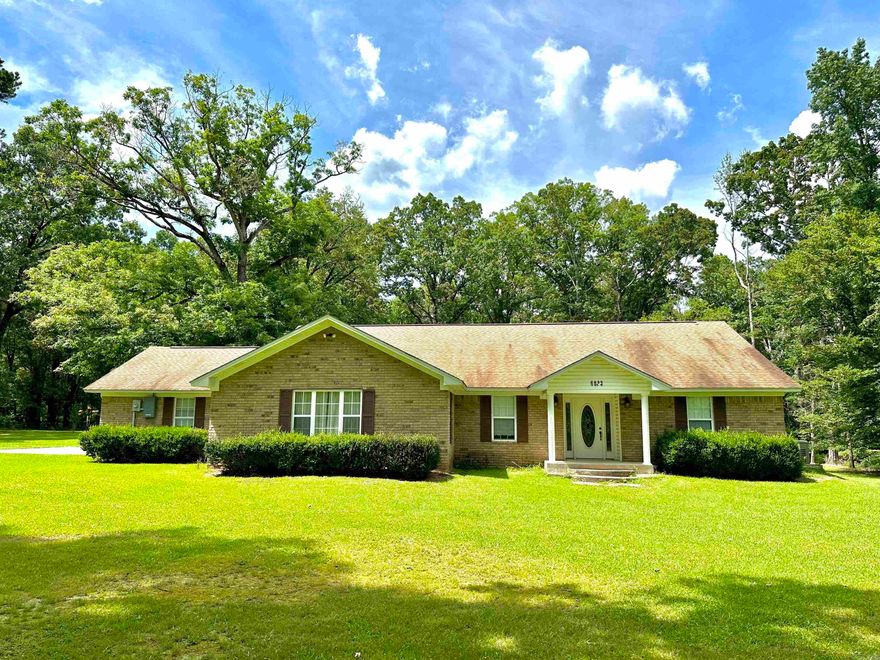 Custom-Built Home on Over 10 Acres! Tucked away at the end of a private drive in a quiet, well-kept subdivision, this custom-built home offers the perfect blend of peaceful country living and convenient access to town. Sitting on more than 10 beautiful acres, this property provides space, privacy, and comfort both inside and out. The spacious home features a well-designed kitchen with custom-built cabinets, complete with pull-out drawers, a cozy breakfast nook, and a large bar seating area. The oversized formal dining room offers plenty of space for family gatherings. The spacious living room is equipped with direct access to the back deck, perfect for relaxing. Enjoy the massive master suite with a large bathroom and generous walk-in closet. The three additional bedrooms each include double closets for ample storage. Additional highlights include an attached oversized two-car garage, a large metal shop building, and a whole-home Kohler generator for peace of mind. This home was built to last with a sturdy 6" slab foundation(above the standard 4"), and includes both gas and electric furnaces and water heaters, ensuring you're never without. This home is priced to sell! Call today!