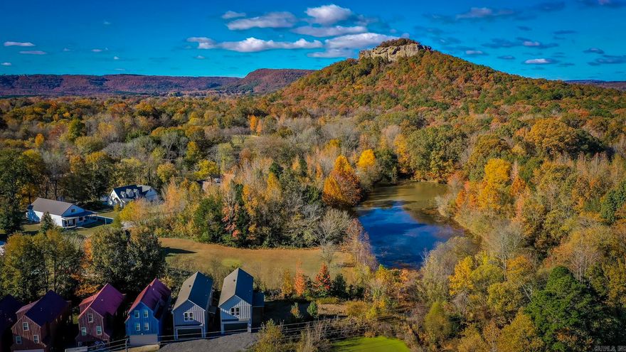 Looking for a new home within walking distance from the Little Red River, this is it! Luxury vinyl throughout. Has a large living room with lots of windows open to the kitchen. Nice sized island in the kitchen with cabinetry in the island. Open concept plan with the primary bedroom separate from the guest bedrooms. Relax under the covered deck with breathtaking views of Sugarloaf Mountain!