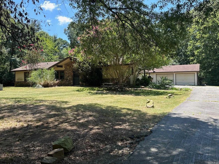 HOME, SHOP, ACREAGE, CREEK, LOCATION This home and shop sit on over three and a half acres with a creek and small pasture with a barn for horses, all at the edge of Conway. The home has a carport and a huge shop with lots of extra storage. In-Ground Pool, but needs work. Move-in now or remodel for a great investment opportunity. The home is being sold AS-IS. Realtors see remarks.