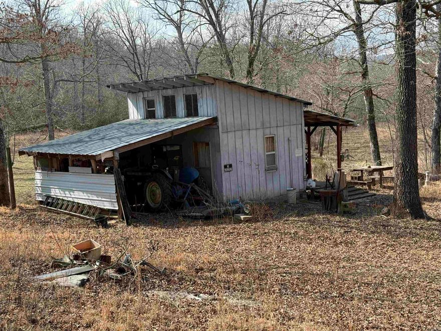 78± acres located just outside Leslie in Searcy County, AR featuring over 1/4 mile of Middle Fork Little Red River frontage along part of the north boundary. This property is set up and ready for hunting with multiple deer blinds, game feeders, established food plots, game ponds, and a well-maintained trail system throughout. The land offers classic Ozarks features including timber, cliffs, rock outcroppings, and natural springs that support abundant wildlife. A cabin with electric is in place, and high-speed fiber internet is available. Ideal for a hunting retreat, recreational getaway, or potential full-time rural residence. Rare opportunity to own river frontage with established improvements in North Central Arkansas. MLS 26007691 joins this property if additional acreage is needed.