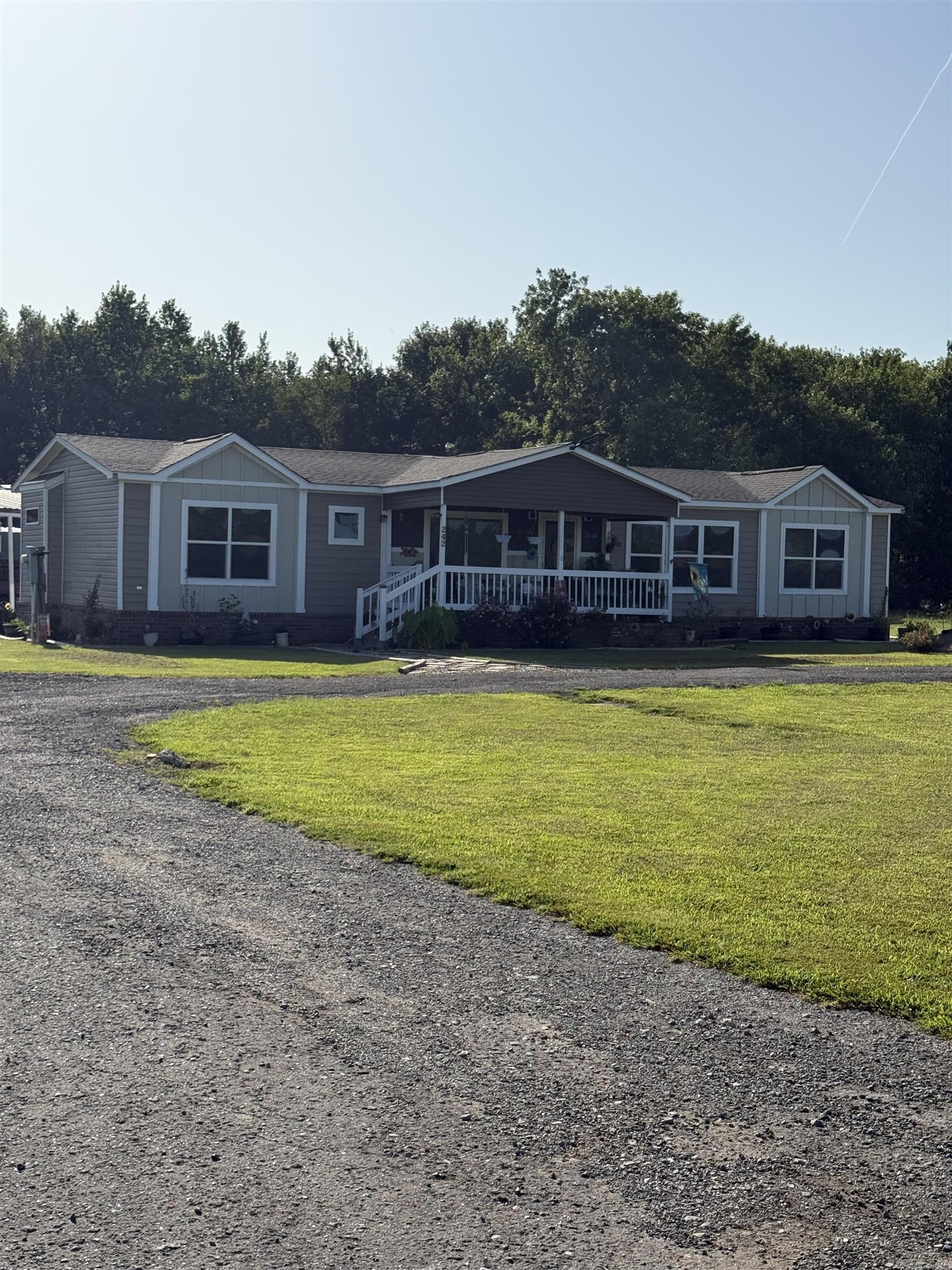 Welcome to this well-maintained 3 bedroom, 2.5- bath double -wide on a permanent foundation sitting on 3 acres. It offers over 1800 sq. ft. of comfort and functionality! This all electric home features a split-bedroom, open floor plan with a spacious living area, dining room, breakfast bar, laundry room, a dedicated craft room and spacious pantry. Additional highlight include a new roof ( 2 years old), new air conditioning, double carport, storage shed, and a circle driveway for your convenience. This one has it all - call today for your private showing. See Agent Remarks!