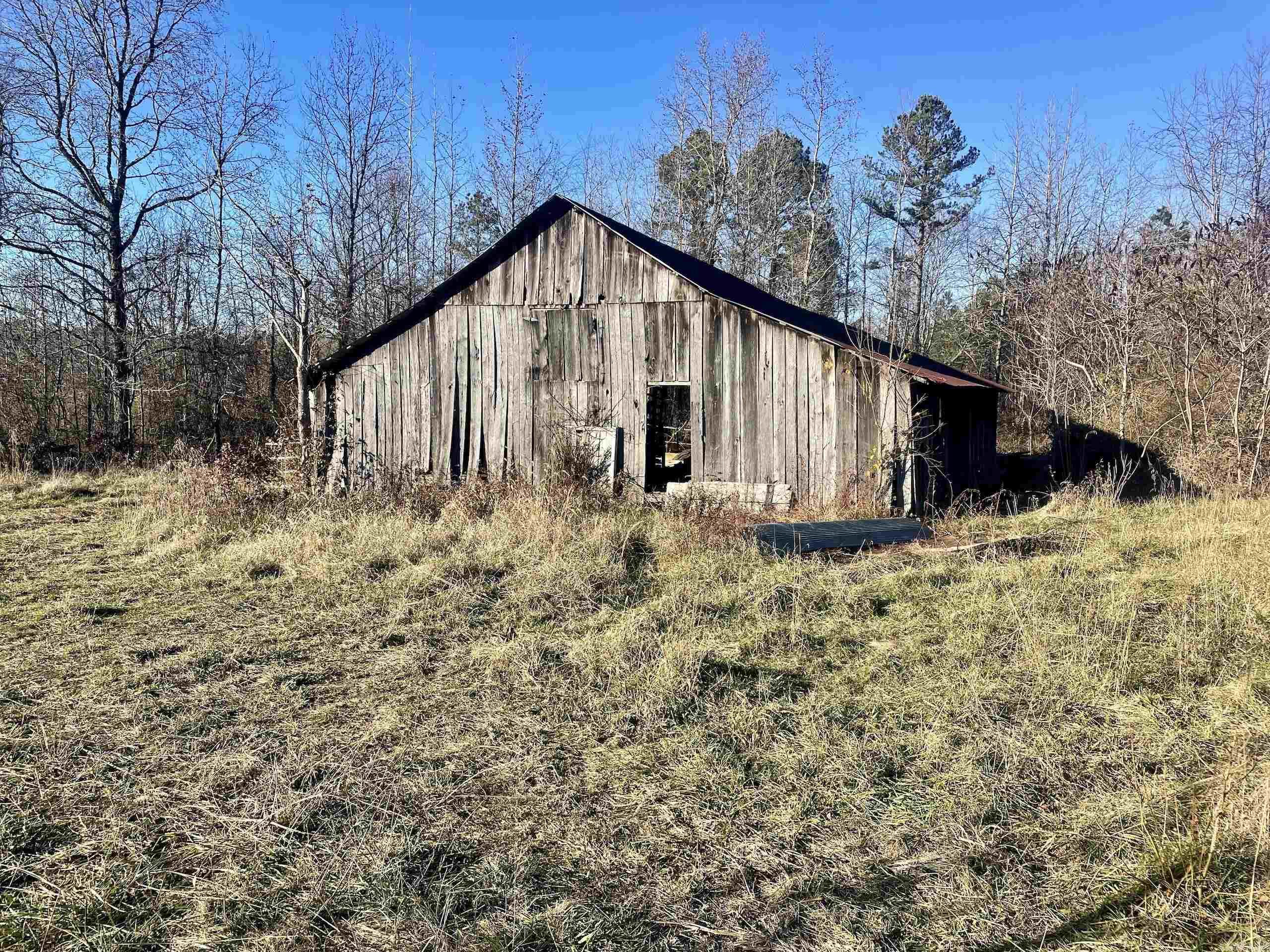 Located just off Highway 16 with over a quarter-mile of county road frontage, this picturesque old homestead combines open fields, mature timber, and abundant wildlife, including deer, turkey, and bear. Ideal for nature enthusiasts and outdoor adventurers, the property is just half a mile from Gulf Mountain Wildlife Management Area and only 5 miles from the Ozark National Forest, offering incredible hunting, recreation, and ATV riding trails. Fairfield Bay Marina on Greers Ferry Lake is a short 30 miles and offering some of the States best boating and fishing. The land features gentle slopes and multiple building sites, making it perfect for creating your dream home or getaway. A tranquil pond provides a serene spot for fishing or relaxation, while the historic barn adds character and potential for use. Utilities, including electricity, rural water, and internet, are conveniently located along the county road, offering easy access for development. Whether you're looking for a recreational retreat or a serene homestead, this property offers the perfect mix of location, beauty, and potential.