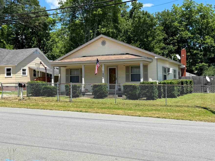 Step into timeless  charm with this well-maintained 1950s home featuring modern updates and classic appeal.  Situated on a spacious corner lot, this 3-bedroom home offers insulated windows, energy-efficient vinyl siding, and a large inviting front porch perfect for mooring coffee or evening relaxing. Enjoy the privacy of a fully fenced backyard-ideal or pets, children or entertaining-plus a handy outbuilding for extra storage or workshop space.  Inside, you'll find cozy living areas and plenty of natural light, blending the character of an older home with the convenience of thoughtful upgrades.  Don't miss this rare fined with curb appeal and prime location. There is a brick area in Dining room for a wood burning stove.  Only 20 minutes to Hot Springs National Park and Oaklawn.