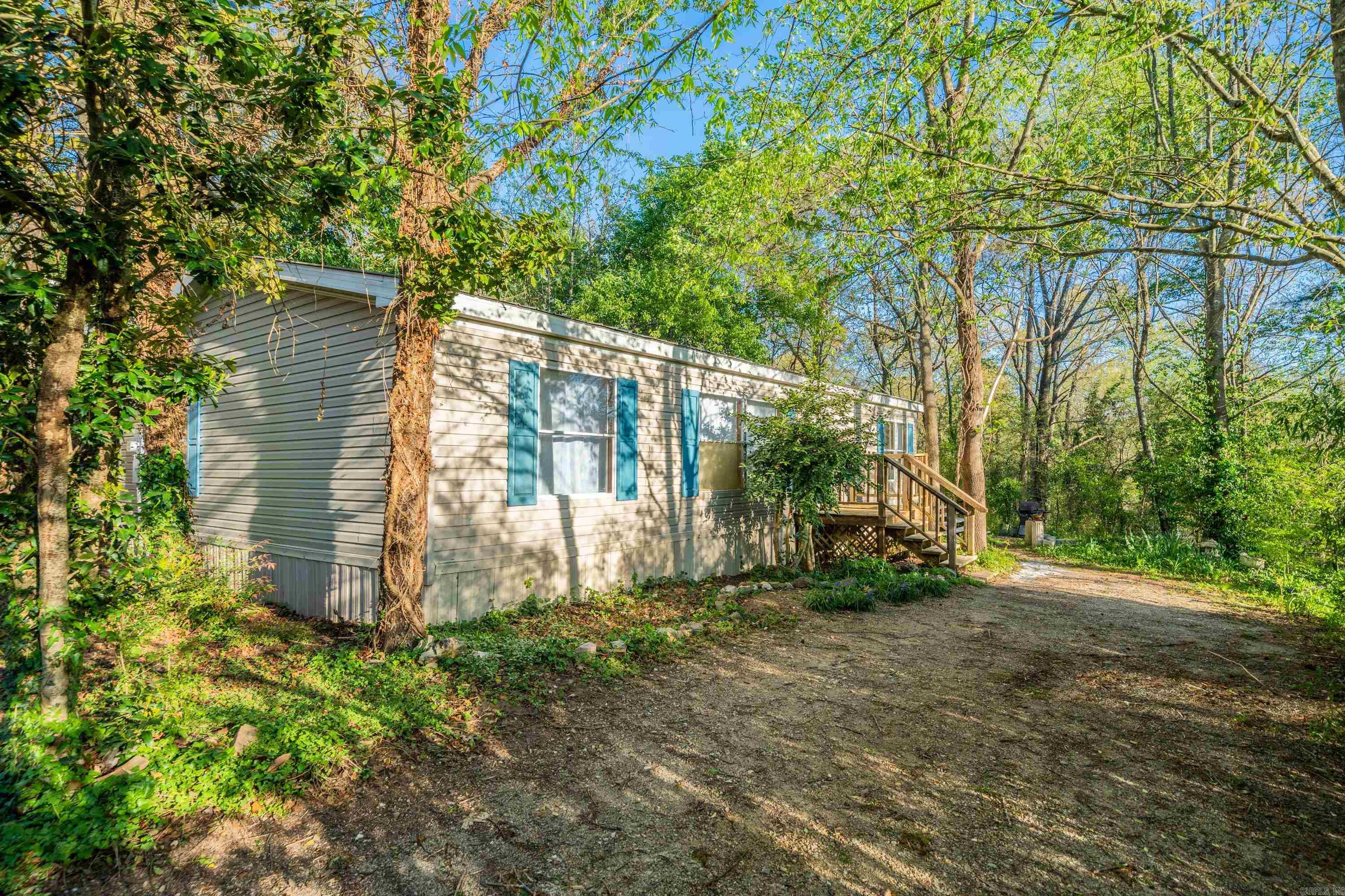 Experience convenience and comfort in this updated 3 bedroom, 2 bathroom home just minutes from the bypass, schools, hospitals, shopping, and Lake Catherine. Relax and unwind in the private backyard complemented by a large spacious deck perfect for enjoying the outdoors. This home features a new metal roof, outdoor storage room, and more. Selling As-is. Call today!