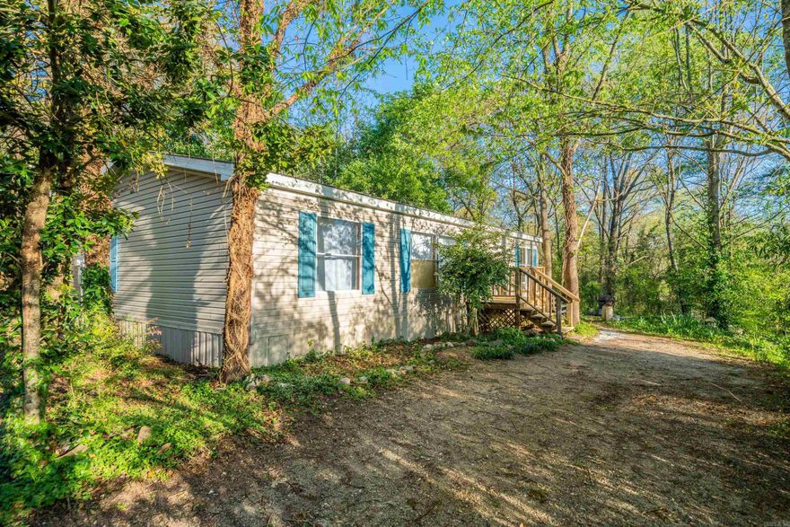 Experience convenience and comfort in this updated 3 bedroom, 2 bathroom home just minutes from the bypass, schools, hospitals, shopping, and Lake Catherine. Relax and unwind in the private backyard complemented by a large spacious deck perfect for enjoying the outdoors. This home features a new metal roof, outdoor storage room, and more. Home has a permanent foundation! Call today!