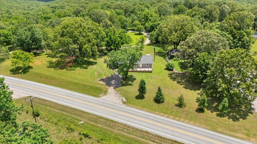 Looking for peace, space, and no neighbors? This 1,848 sq ft home on 1.5 acres m/l offers just that—only one mile from Mountain Home, yet feels a world away. With 3 bedrooms and 1.5 bathrooms, the home was completely rebuilt between 2015–2021 with new floors, kitchen, HVAC, water heater, insulation, paint, and a refreshed layout. Enjoy cozy evenings by the woodburning fireplace or entertain on the oversized front and back decks. A fenced dog run is ready for pets or a garden, and there’s space for an RV hookup or second home with an existing well, electric, and second septic. Two outbuildings and a huge storage room in the house provide tons of project space. No visible neighbors—just land, sky, and freedom.