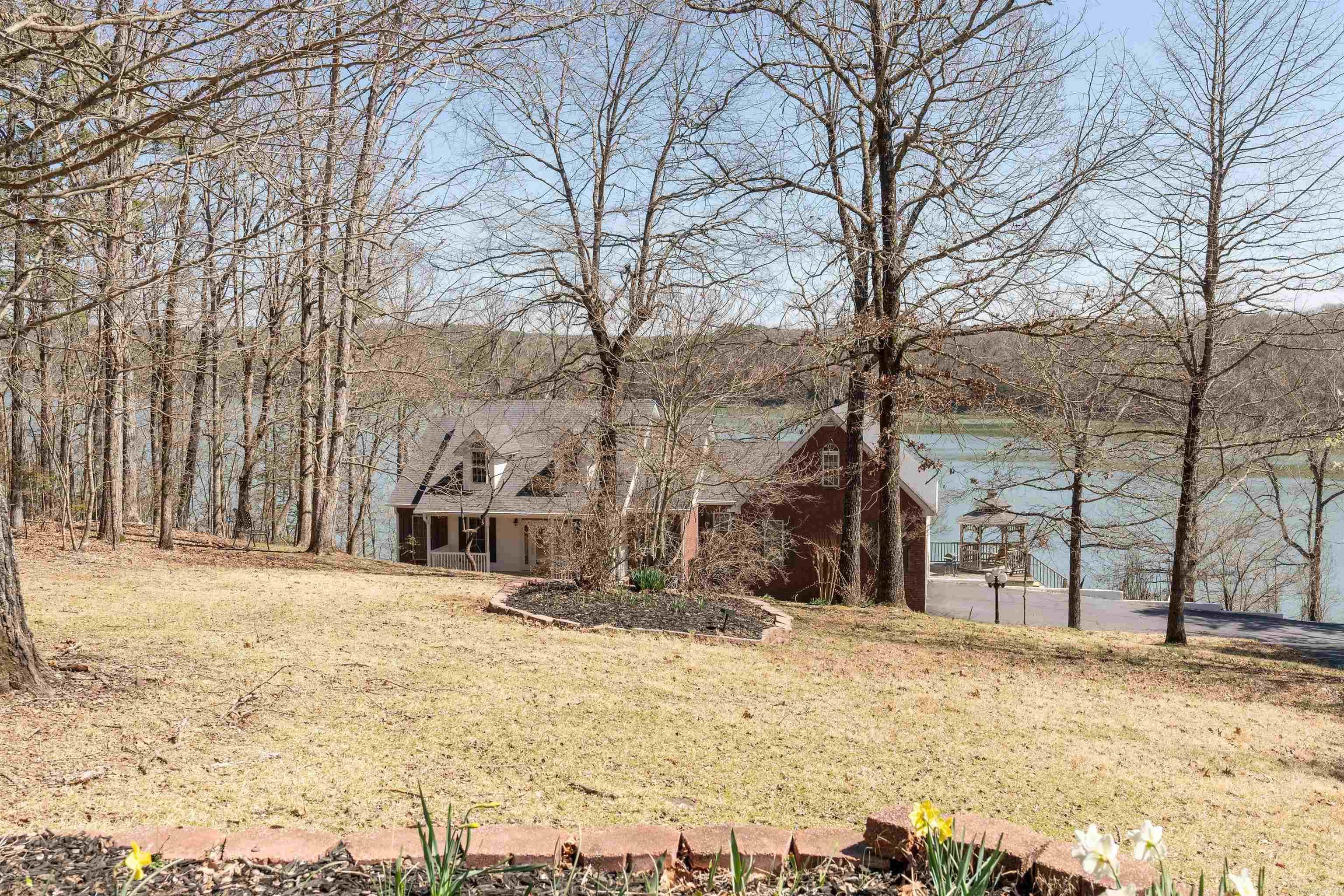 Lakefront Paradise with Stunning Greers Ferry Lake Views and Great Fishing! Wake up to breathtaking sunrises over Greers Ferry Lake in this beautiful 3-bed, 3-bath home with a large bonus room over the garage. Enjoy direct lake access with a community dock, your own slip with lift (#7), for endless water sports and fishing. Step inside to find updates, including a new refrigerator, a newer high efficiency HVAC system installed 3-2020, a leaf guard system in 2024, and a new lower deck with a Hot Tub. The master suite features a walk-in closet with access to a two-story storm shelter for added peace of mind. Outside relax while taking in the panoramic lake views from the spacious back deck. With two lots included, thereās plenty of room to enjoy the great outdoors. This is lakeside living at its finest. Come Live the Lake Life! āschedule your showing today!