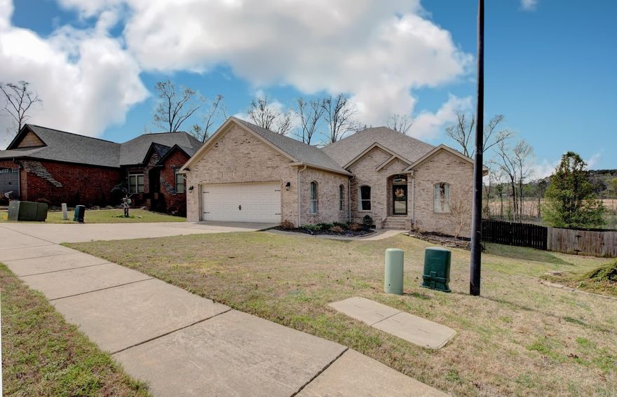 Welcome to 6859 Grace Village Drive. This gorgeous home offers large open living spaces filled with an abundance of natural light, a split floor plan, 3 large bedrooms, 2 full baths, and a large pass through primary closet to a dedicated laundry room. The kitchen has a walk in pantry, brand new cooktop, stainless appliances and breakfast bar. The primary bedroom offers a large spa-like ensuite that was updated in 2023, featuring a soaking tub and separate showing with custom tile work. The patio opens out to a roomy backyard and a storage/workshop area under home. Roof and new carpet installed in 2022, new heat pump in 2023, plus drainage/french drain system in 2023. Bryant Schools.