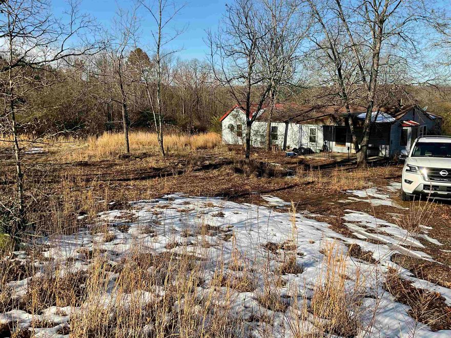 MOTIVATED SELLER !!!!  MAKE OFFER  If you want a fixer upper here it is ,or you can tear this home down with water power already on this property it will be easy to build your perfect dream home . I did just find out this is commercial 1 / Residential lot   Right down from Ozark medical Center , Shopping ,Walmart , Restaurants .