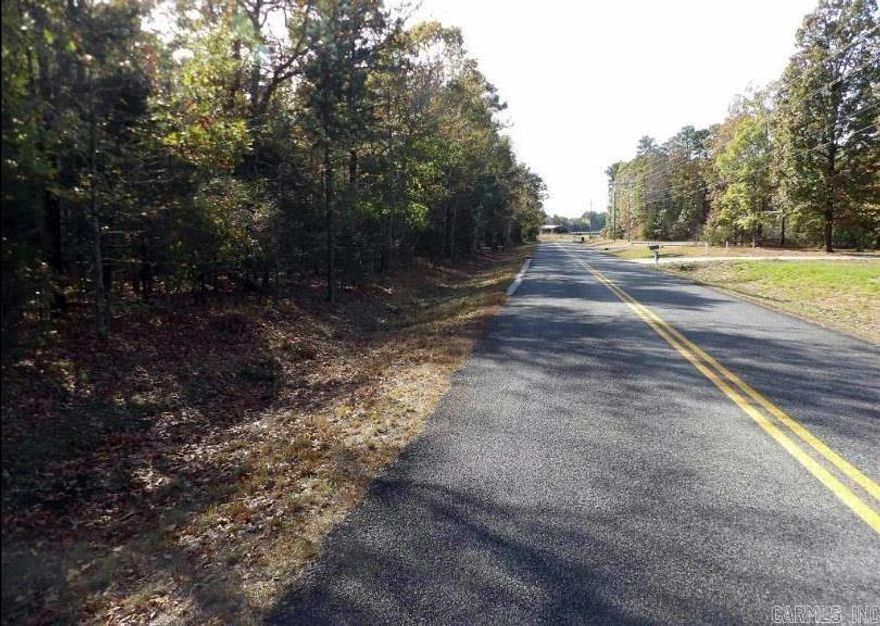 Beautiful tree-covered residential lot in a restricted unrecorded subdivision ready for your new home.