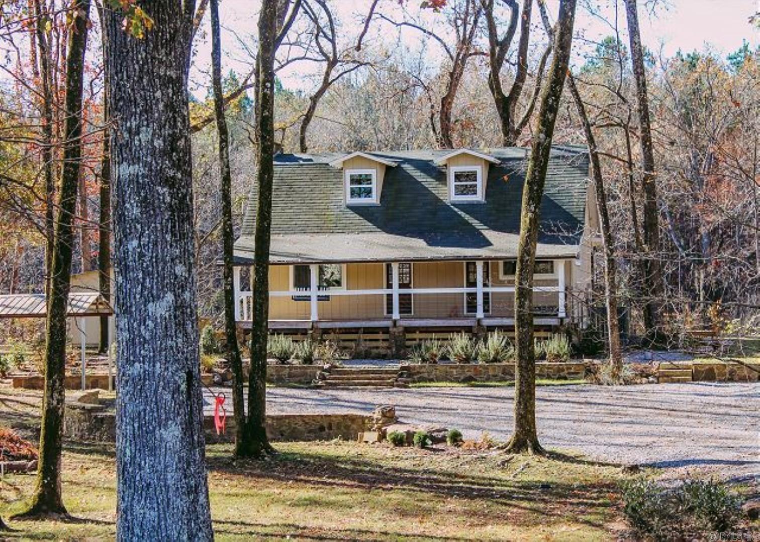 Bring your fishing gear to the famous LITTLE RED RIVER, or just sit and gaze out at the water from the deck or back porch and enjoy the fire from the stone firepit on those chilly afternoons. This updated riverfront offers beautiful river views, access for fishing, close to town, covered boat dock for your boat, large back deck, and balcony all for your enjoyment. Come inside and cozy up in front of the wonderful stone fireplace and cook a great meal in the updated kitchen. Upstairs offers an open loft style sleeping area, custom built bunk beds on one side and queen bed set up on the other side with bathroom for the convenience of any guests that come to visit. Must call for a showing!!