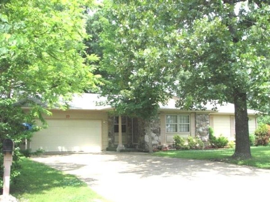 CART DISTANCE TO SOUTH COURSE! 3 Bedroom, 2 bath home with an attached garage. Larger home has a covered deck and a shady fenced back yard. The living room features a stone fireplace with wood burning insert for your enjoyment. Heat Pump and ceiling fans throughout the house. The kitchen features dishwasher and range with an adjoining dining area. There is even space for a separate dining room or a den. It has a water heater & water softener in the utility room. Under the house is space for storage. #1942
