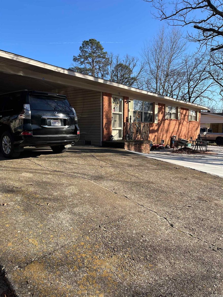 This 4 bedroom, 1.5 bath brick and vinyl home offers approximately 2,222 square feet of functional living space. Hardwood floors run throughout the home, complementing the comfortable layout. The main living area features a fireplace, while a bonus room provides flexible use options. Additional highlights include a workshop, paved driveway, and a small back patio ideal for outdoor enjoyment. This property offers a blend of practical features and versatility in a well-rounded home.   Agent related to seller.