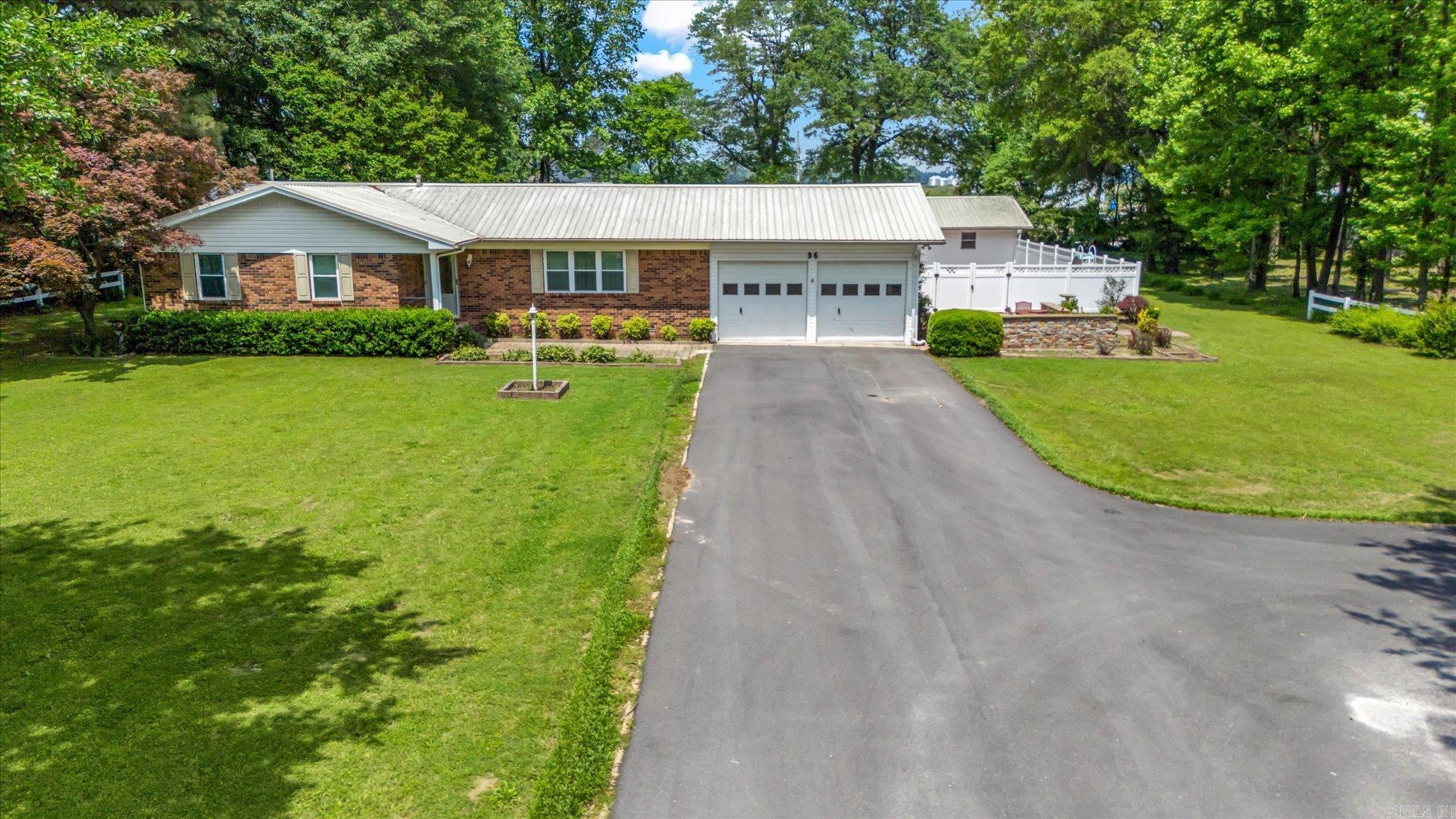 Move-In Ready Home with Pool, Shop, and Acreage in Valley View School District! Have you ever dreamed of having a home in the country side bordered by a white picket fence? If so, now is your opportunity! Welcome to 96 County Road 468, beautiful ranch-style home sitting on 1.05 acres in the highly sought-after Valley View School District. This charming 3-bedroom, 2-bath home offers the perfect blend of country living and modern convenience. Step inside to a large, inviting living room anchored by one of three fireplaces found throughout the home. A second living area opens up to the kitchen, with easy flow to the formal dining room and sunroom. The sunroom overlooks your private backyard oasis, featuring an in-ground pool, water features, and even a fish pond. The spacious shop is perfect for hobbies or additional storage and includes a full bathroom and garage door, making it a truly versatile space. Recent updates include: New HVAC system, asphalt driveway, pool cover and all furnishings convey! This home is truly move-in ready. From the moment you pull up to see the picket fence and lush landscaping ,you'll know you're home. Schedule your tour today!