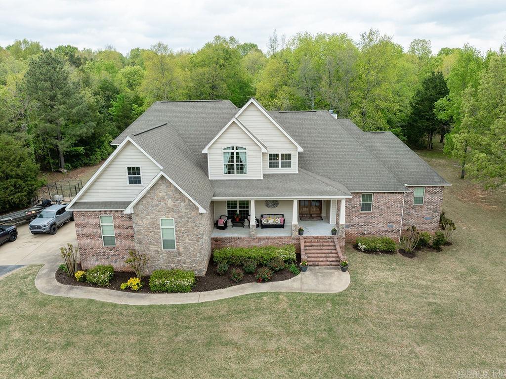 This luxurious residence is situated on the west side of Searcy, spanning 4.5 acres and boasts an impressive array of features, including a professional-grade kitchen with center island, large gas stove, and breakfast bar as well as an extra-large laundry/craft room, 5 bedrooms, 3.5 baths, and a bonus room. The open floor plan seamlessly integrates with the nicely appointed covered porch and new outdoor kitchen while additional highlights include a covered front porch, gas log fireplace, outdoor fireplace and a primary suite complete with separate tub and shower. Call today to schedule a tour.
