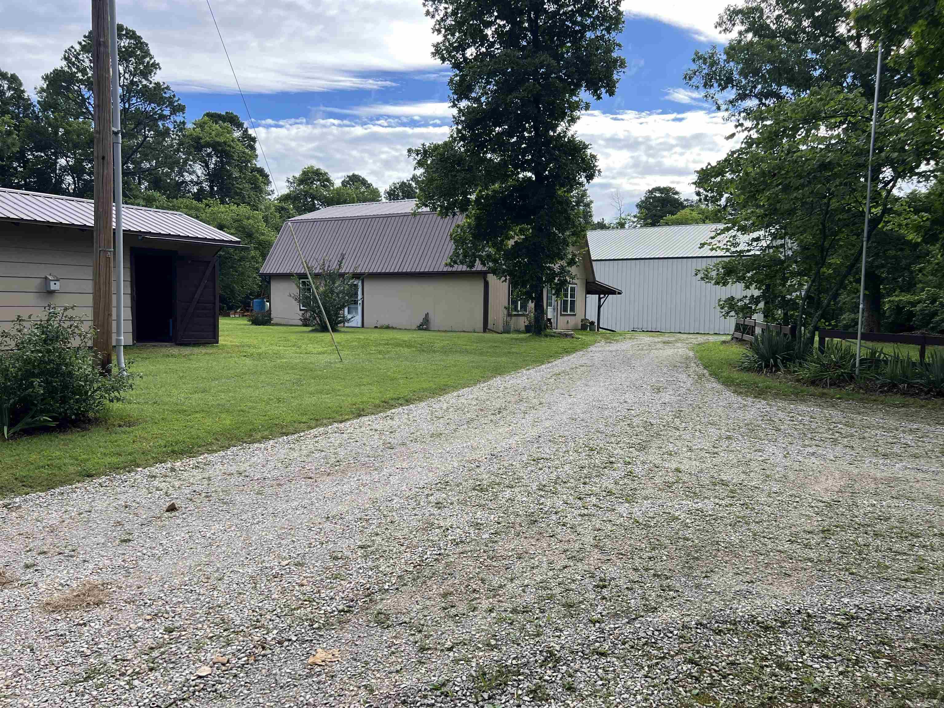Looking for a home in Mountain View, AR ? Look no further. Mountain View is home to The Folk Music Capital of the world, the beautiful White River, Blanchard Springs Caverns , the Ozark Folk Center, the picking park, scenic Ozark Mountains. Here is a 1400 sq. ft cabin that sits on 13.81 level unrestricted acres. The cabin supports 1 Bedroom and 2 Bathes large garage that has ben partially converted into storage but could easily be converted into living area, there is a large propane generator for backup power. There is also a large Shop 60x96 that is perfect for any project you might have, also comes with a RV hookup and a storm shelter. Only 1/2 mile from State Hwy 5 Come take a look.