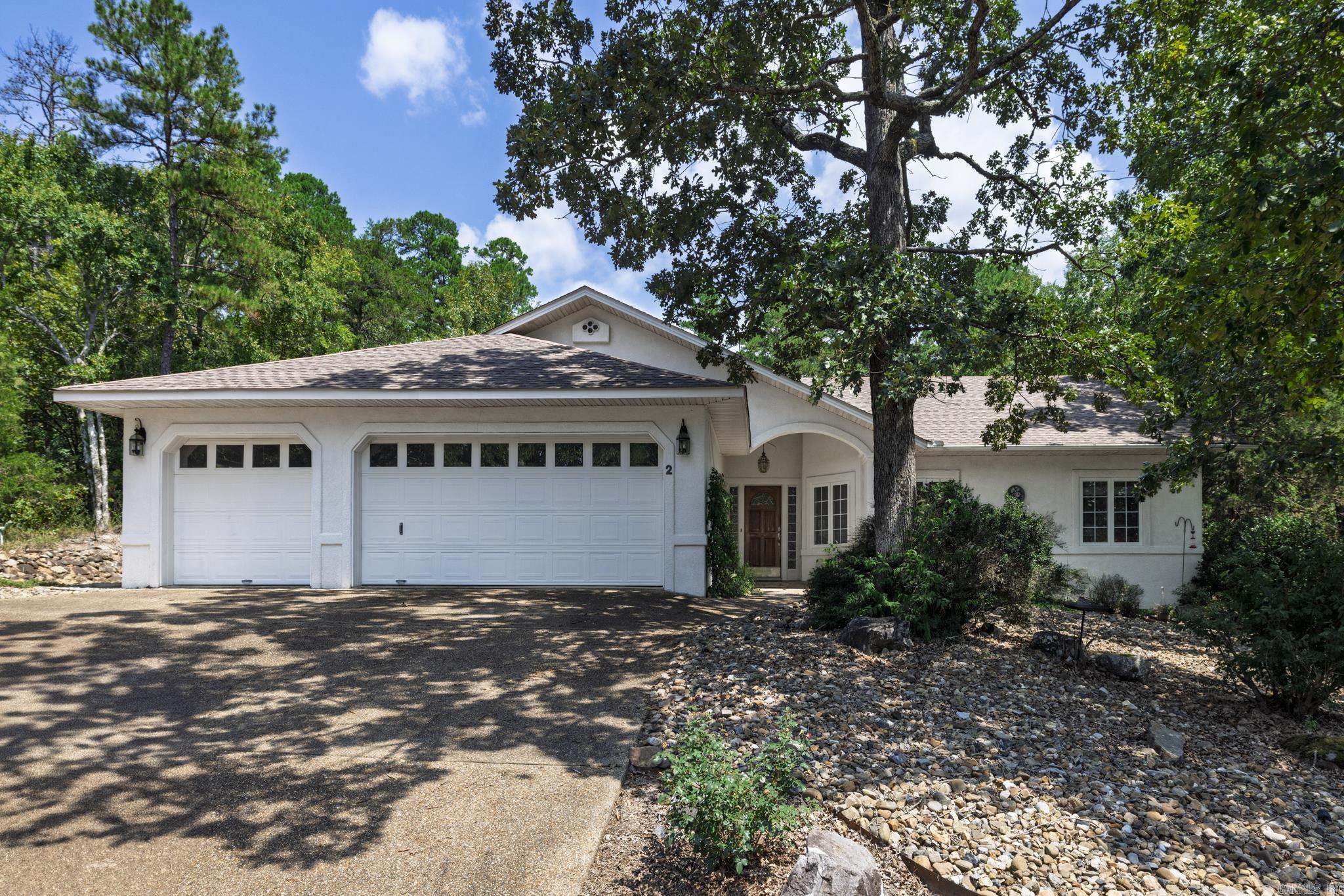 2 Dominar Place ā ideally located between Balboa and Coronado Golf Courses in Hot Springs Village! Enjoy easy access to top-tier amenities including Grills at both Courses, Balboa Marina and Beach, with Sunset Grill, and Molly OāBrienāsāall just minutes from your doorstep. This 3-bedroom, 2-bath home offers 2,010 sq ft of comfortable, well-designed living space. The open floor plan seamlessly connects the living, dining, and kitchen areasāperfect for entertaining or quiet evenings at home. The primary suite offers a spacious retreat with a walk-in closet and en suite bath. Step outside to your covered patio overlooking a beautiful water feature, where you can relax to the peaceful sounds of babbling water and enjoy the sights of local wildlife. This tranquil outdoor space is truly a retreat all its own. Additional features include a 2-car garage, laundry room, and low-maintenance landscaping. Whether you're a golf enthusiast, nature lover, or simply looking for the ideal place to call home, 2 Dominar Place delivers the best of Village living. Don't miss out!
