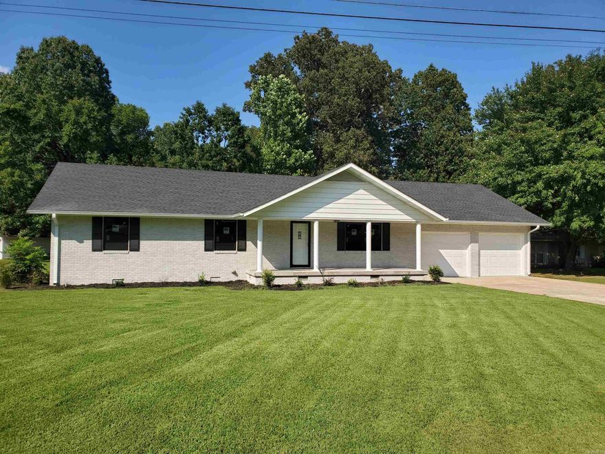 1017 Homecrest Dr in Piggott, Ar. is a 3BR, 2BA, 1,581SF home sitting on a huge 0.67-acre lot in the heart of Ballard Heights just beside the Sugar Creek Country Club! This stunning brick home has been completely gutted and remodeled from top to bottom, inside and out! The kitchen is an absolute work of art with stunning new stainless-steel appliances and a gorgeous new granite countertop! The open floor plan with lots of brand-new windows allows for the sun to shine throughout the kitchen, dining and living room areas! A peaceful sunroom, just off the dining room, lets you relax and soak in the beautiful backyard overlooking sugar creek. Three large bedrooms gives everyone their own private space. The master has its own newly remodeled bathroom! The large 2 car garage has a built-in workshop that gives plenty of space to work on projects and store your tools. The huge 0.67-acre lot gives the kids plenty of room to play ball, or to plant that dream garden, or build that perfect man-cave shop you've always wanted! This amazing property can be your forever home!!
