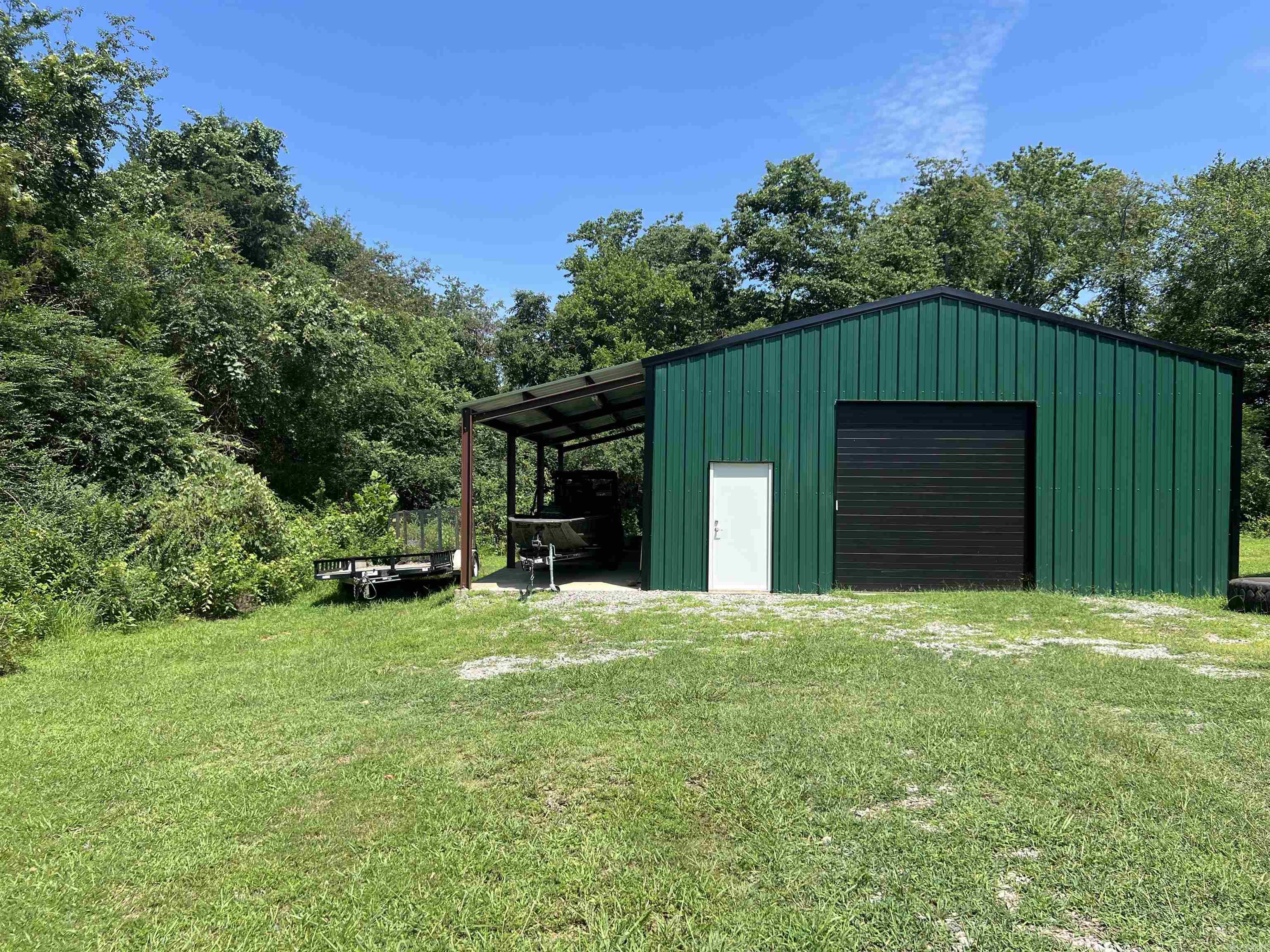 Plenty of opportunities for this property. Perfect location, great metal building which is presently used as a personal gym. 30x40 building on beautiful lot containing 1.61 acres. Building is heated and cooled. Only a few minutes from Searcy Country Club. Call to view this property today. SEE AGENT REMARKS.