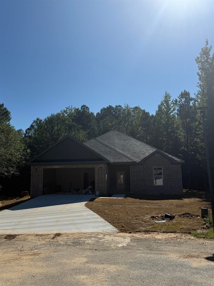 Welcome to your brand-new home at the end of a quiet cul-de-sac in the desirable Meadow Creek subdivision of Haskell, AR. This thoughtfully designed residence combines modern finishes with everyday convenience, making it perfect for families or anyone looking for a fresh start.  Step inside to find luxury plank vinyl flooring throughout, offering both durability and style. The spacious open floor plan creates a seamless flow from the living room to the kitchen and dining area. The kitchen features granite countertops, custom cabinetry, and all-electric appliances, ready for both weeknight dinners and weekend entertaining.  The primary suite includes a spa-like bath with a beautifully tiled walk-in shower, double vanities, and a large walk-in closet. Additional bedrooms are generously sized, offering comfort and flexibility for family, guests, or a home office.  Located just minutes from Harmony Grove Schools, this property offers the peace of cul-de-sac living while keeping you close to town amenities. With modern construction, quality finishes, and a prime location, this home is move-in ready and built to impress.